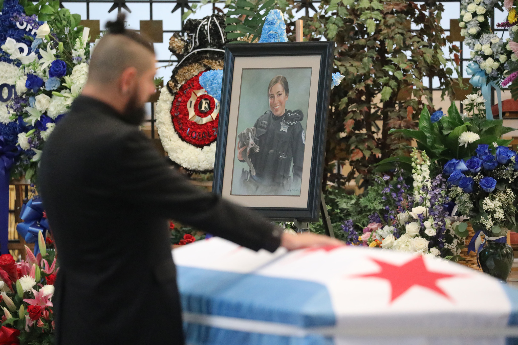 A framed picture of Chicago police Officer Ella French appears...