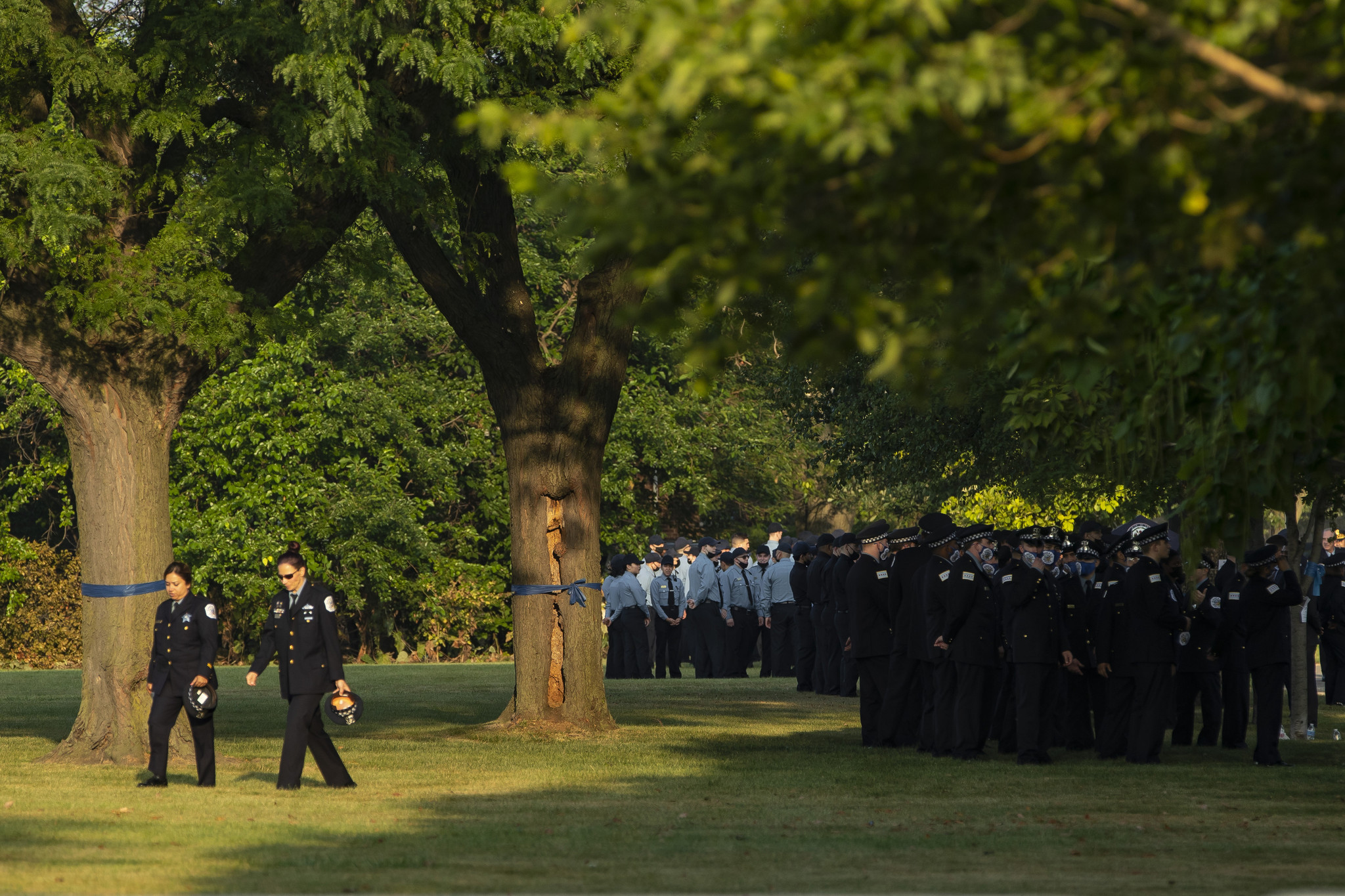 Chicago police officers stand in formation at the funeral service...
