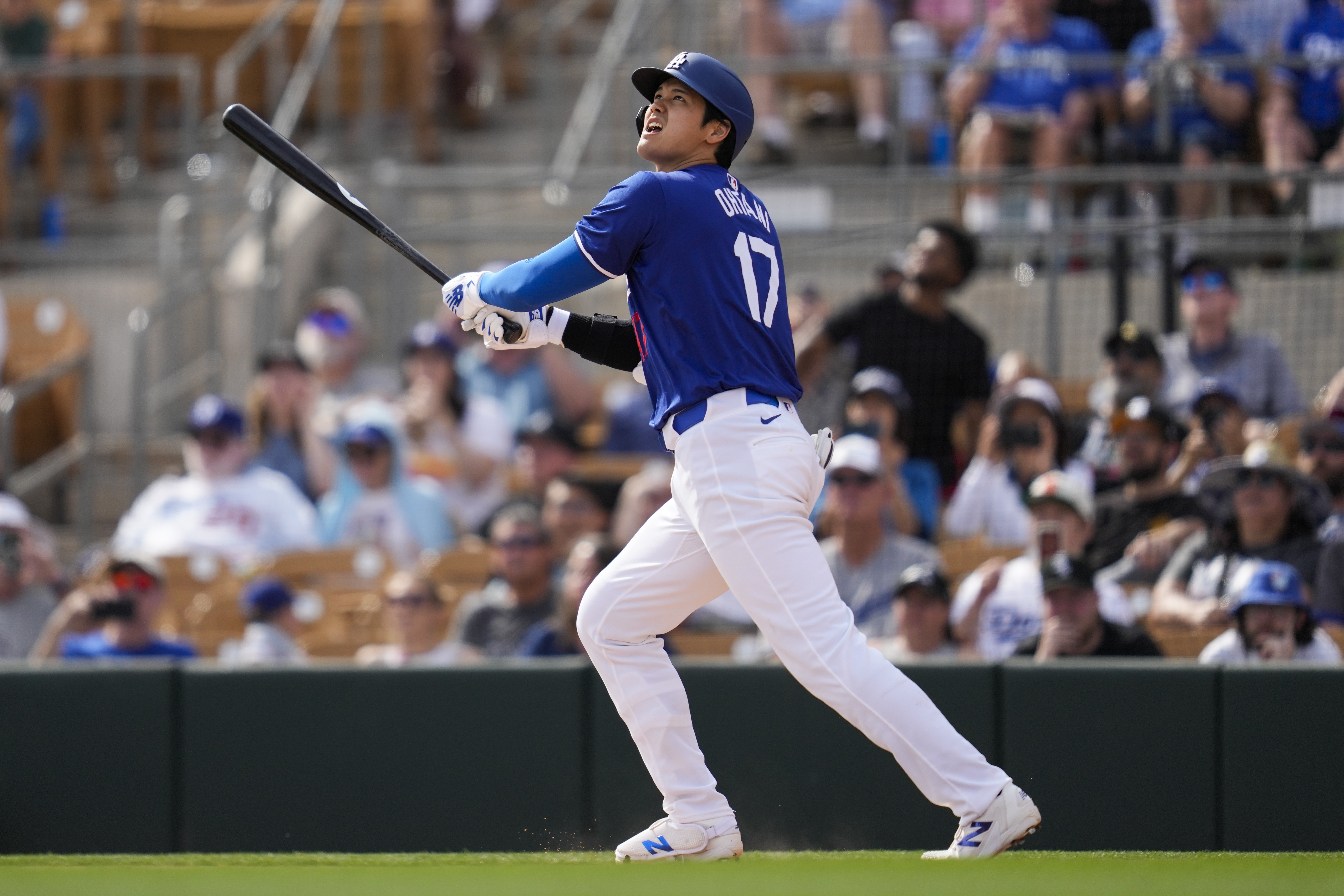 Dodgers designated hitter Shohei Ohtani watches his two-run homer during the fifth inning against the White Sox on Tuesday, Feb. 27, 2024, in Glendale, Ariz. (AP Photo/Ashley Landis)