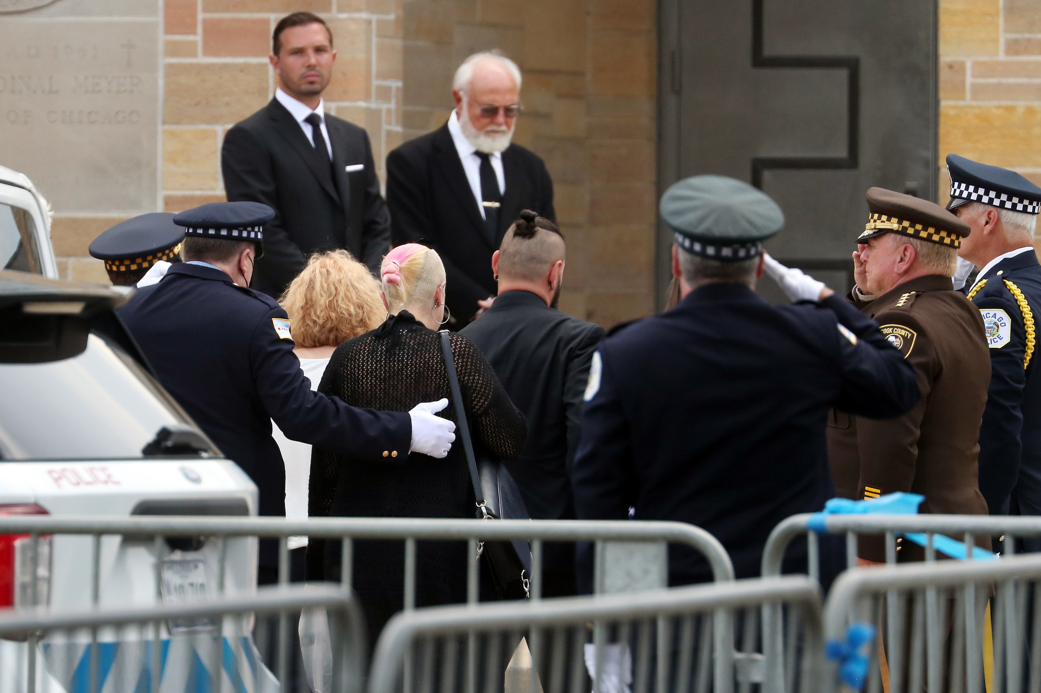 Mourners arrive at St. Rita of Cascia Shrine Chapel in...