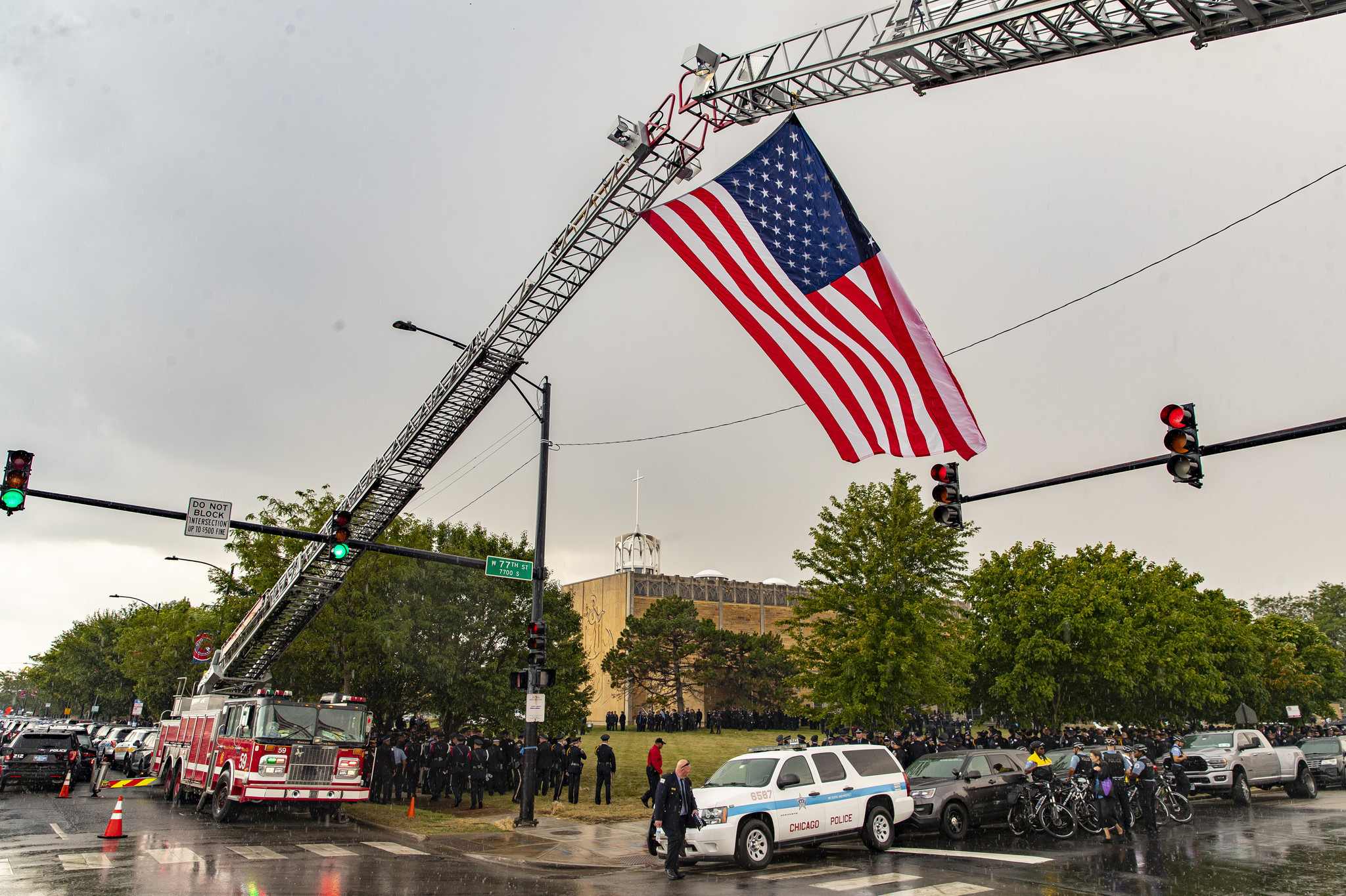 The U.S. flag is flown between two Chicago Fire Department...