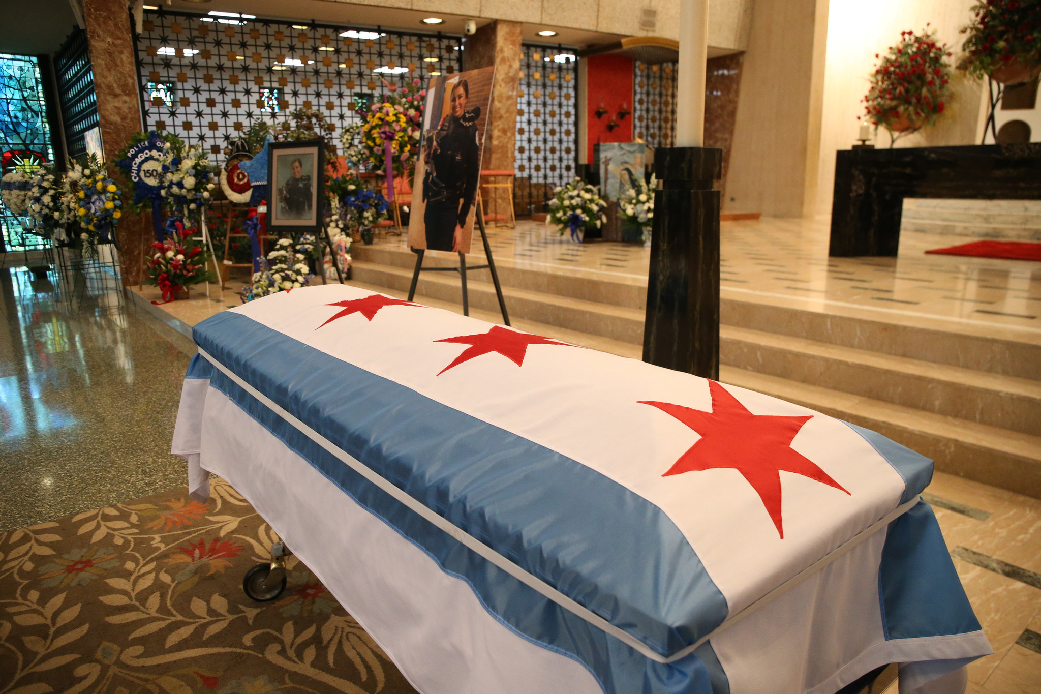 The casket of Chicago police Officer Ella French is covered...