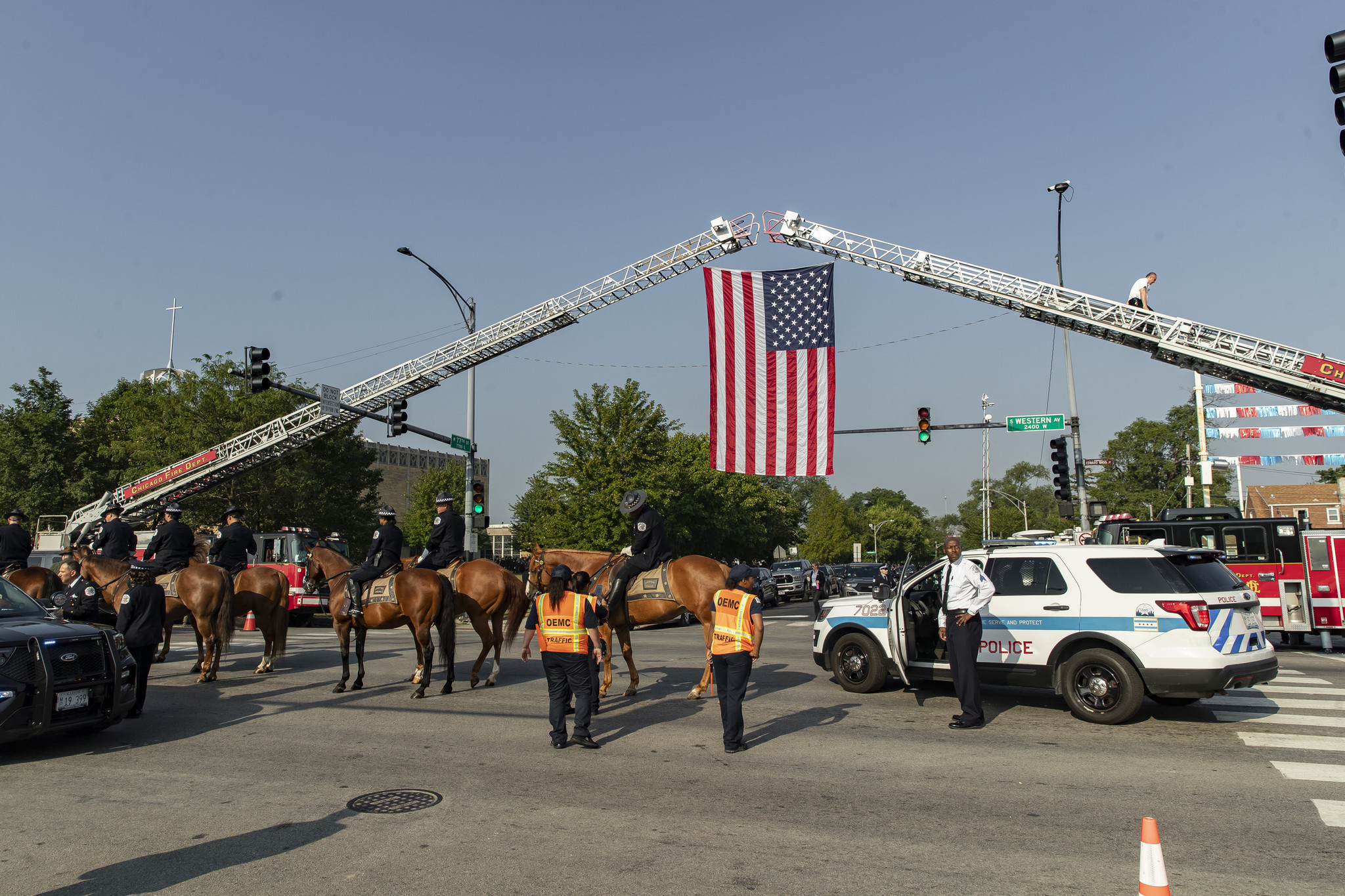 The U.S. flag is flown between two Chicago Fire Department...