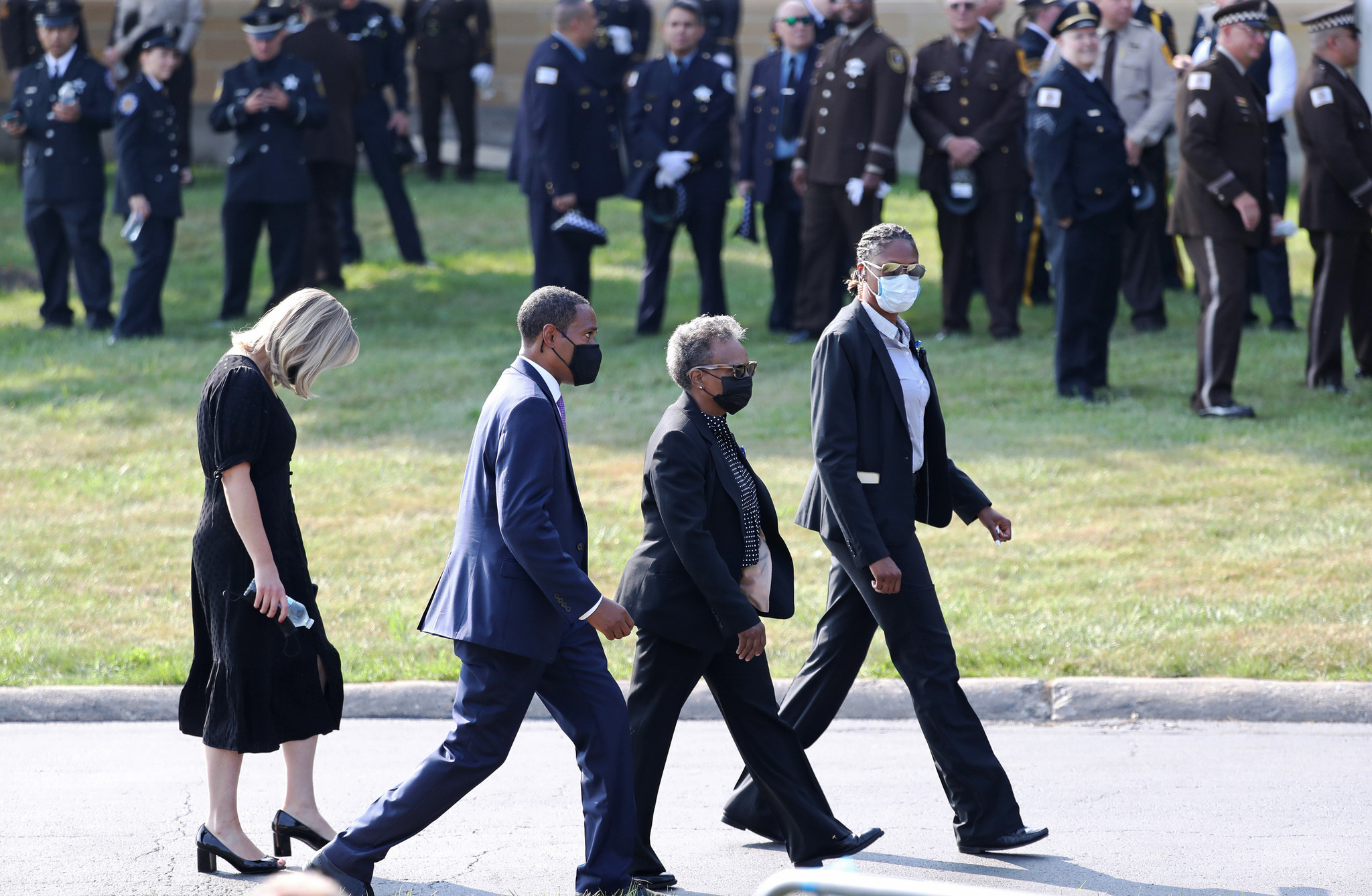 Mayor Lori Lightfoot, second from right, arrives for the funeral...