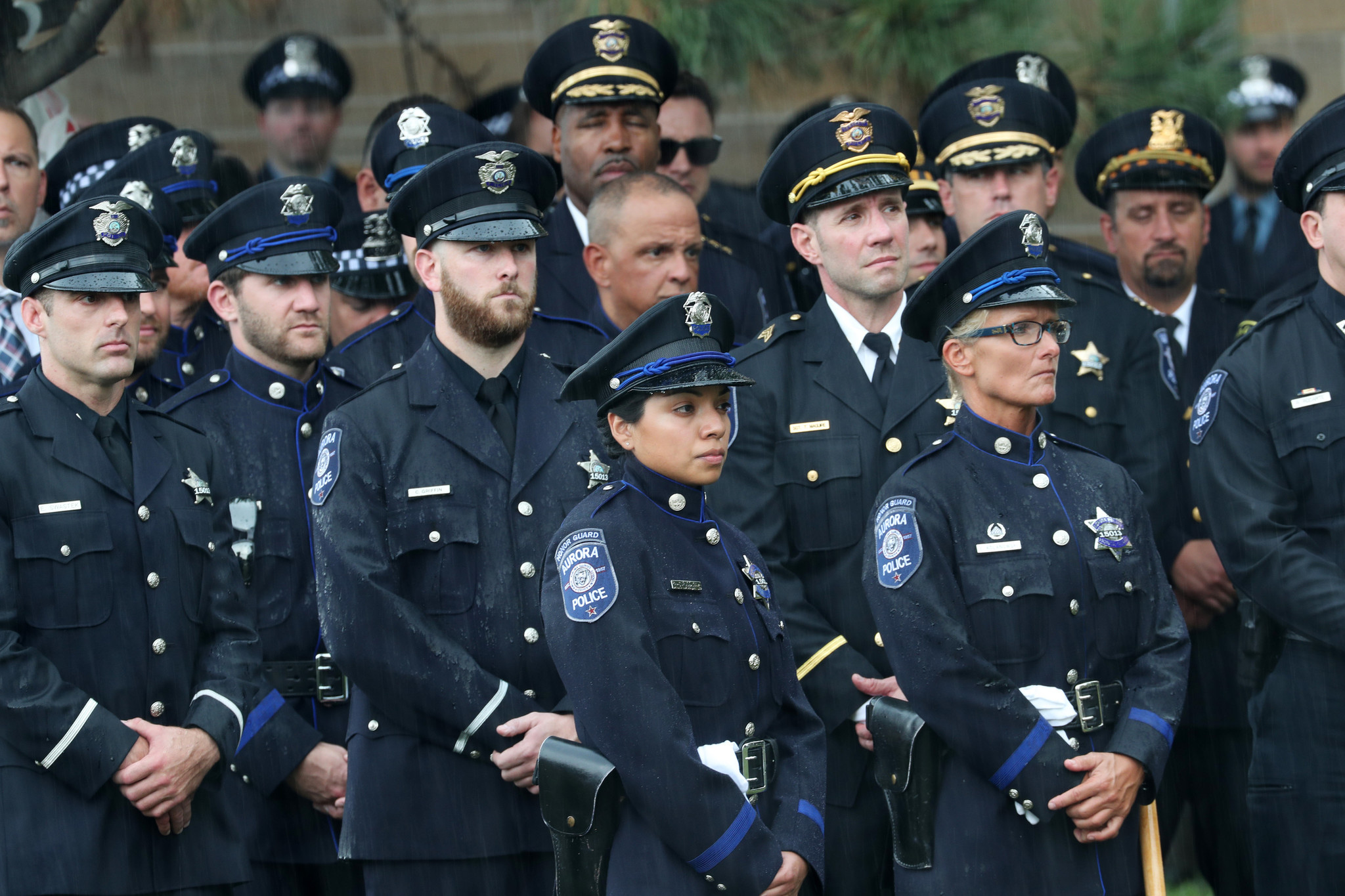 Police officers stand outside the funeral for Chicago police Officer...