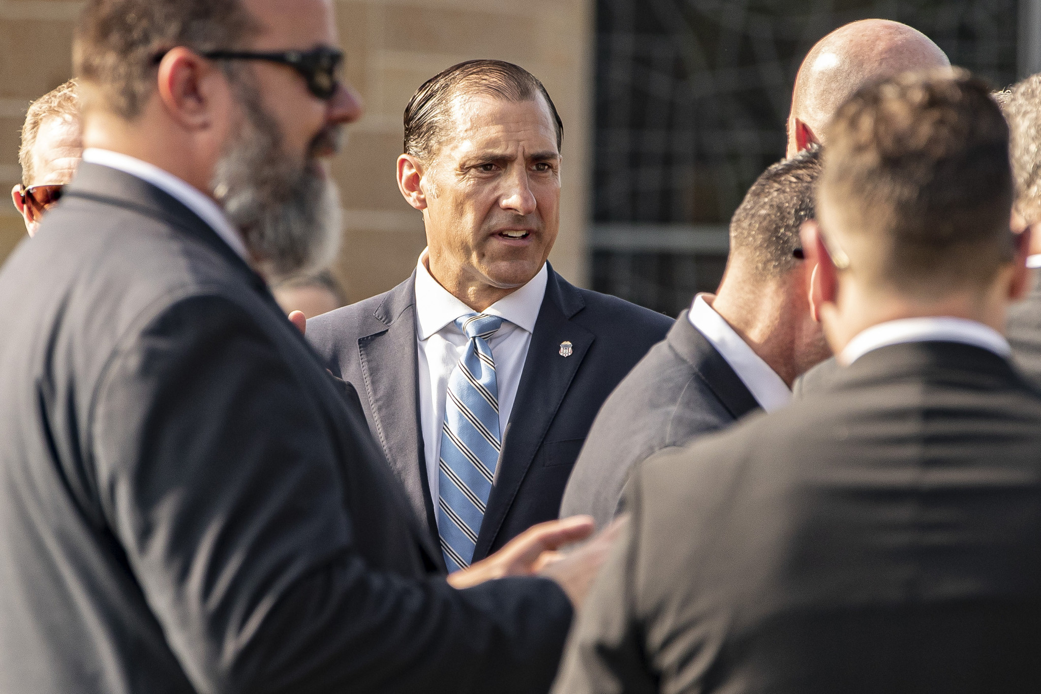 U.S. Attorney John Lausch is seen at the funeral service...