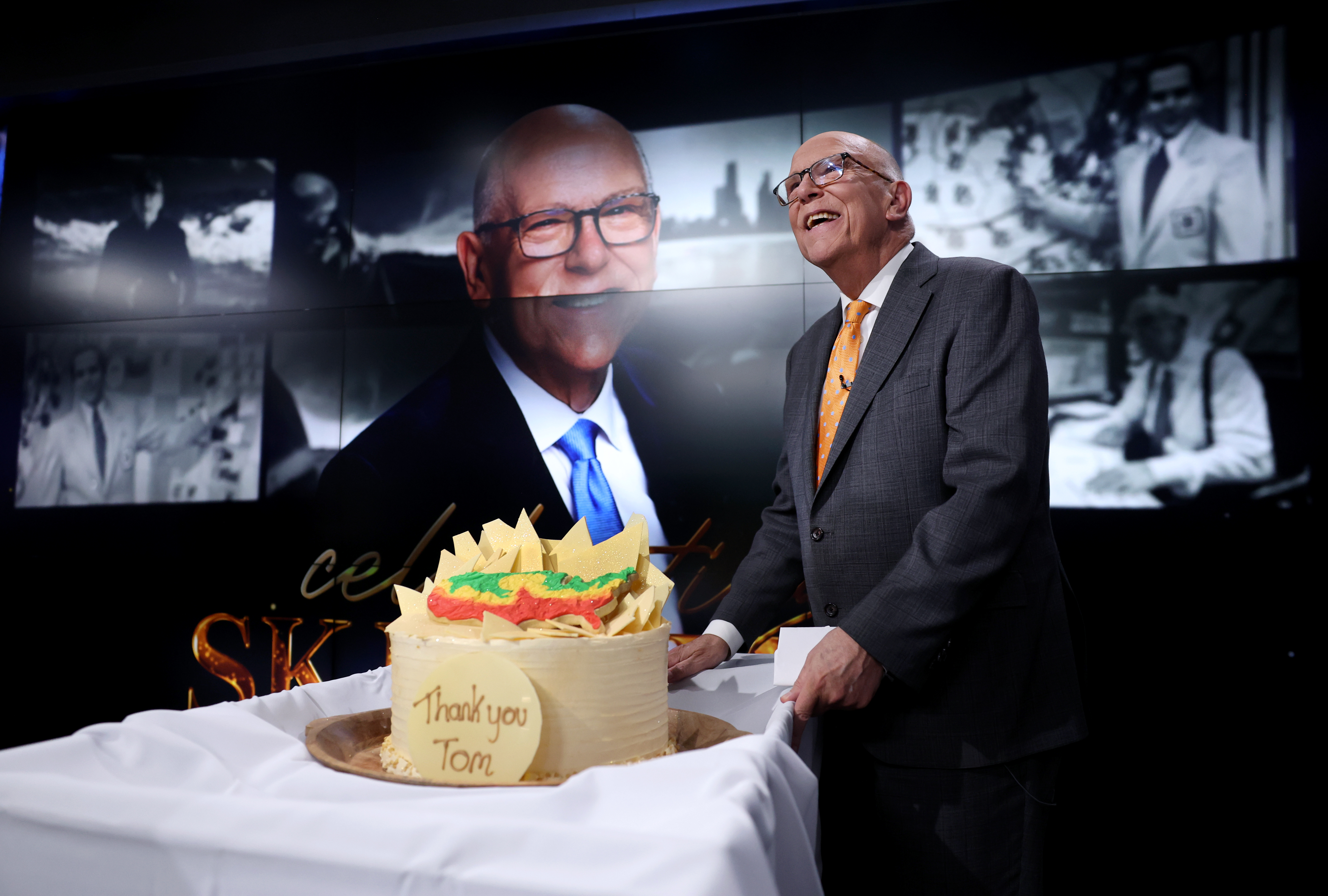 WGN-TV chief meteorologist Tom Skilling stands beside his celebratory cake after his final broadcast during the 10 p.m. news on Feb. 28, 2024. (Chris Sweda/Chicago Tribune)