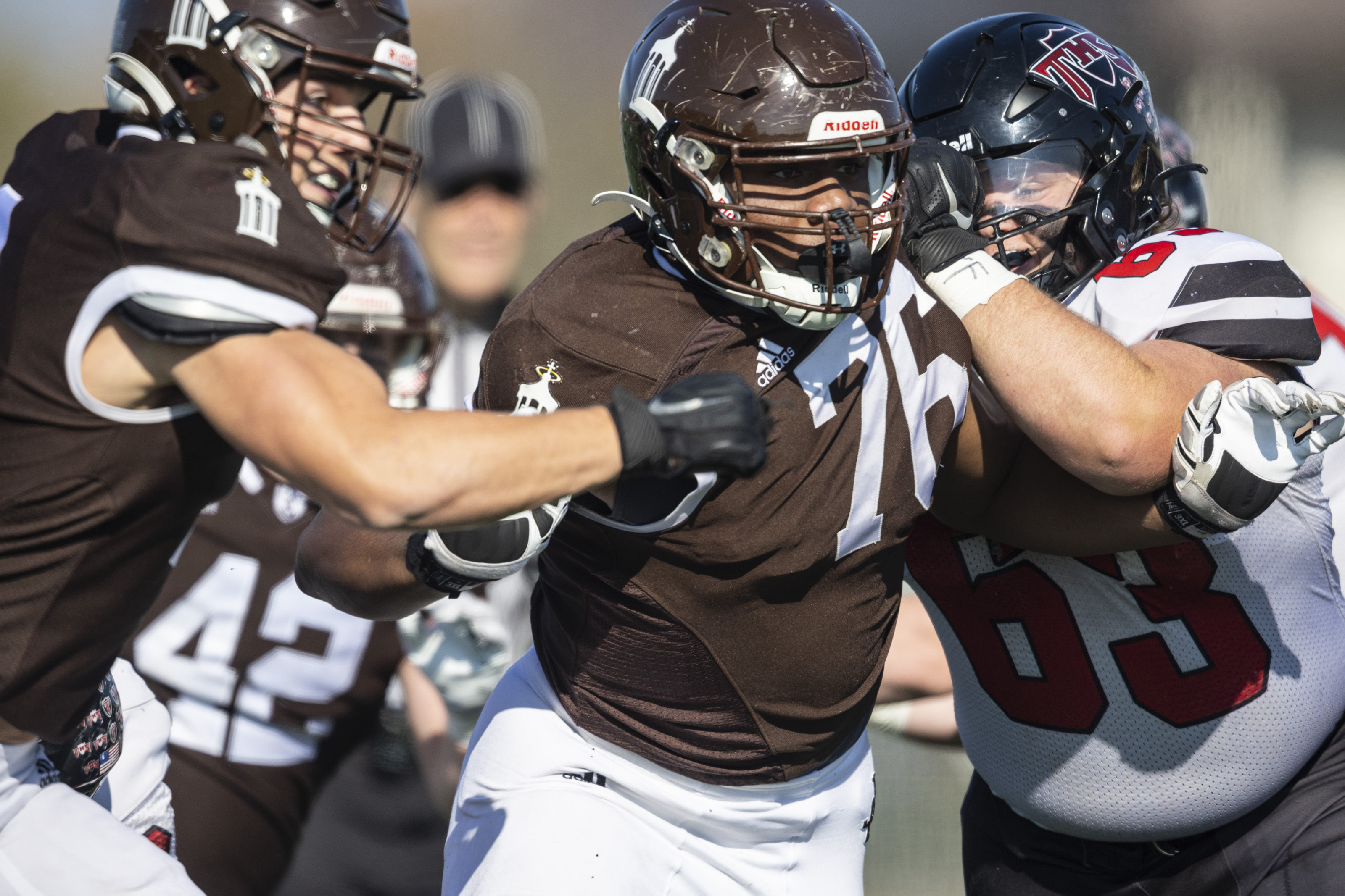 Joliet Catholic's Dillan Johnson (76) tries to get through Troy Triad's Zach Van Tieghem (63) during a Class 5A second-round playoff game at Joliet Memorial Stadium on Saturday, Nov. 4, 2023.