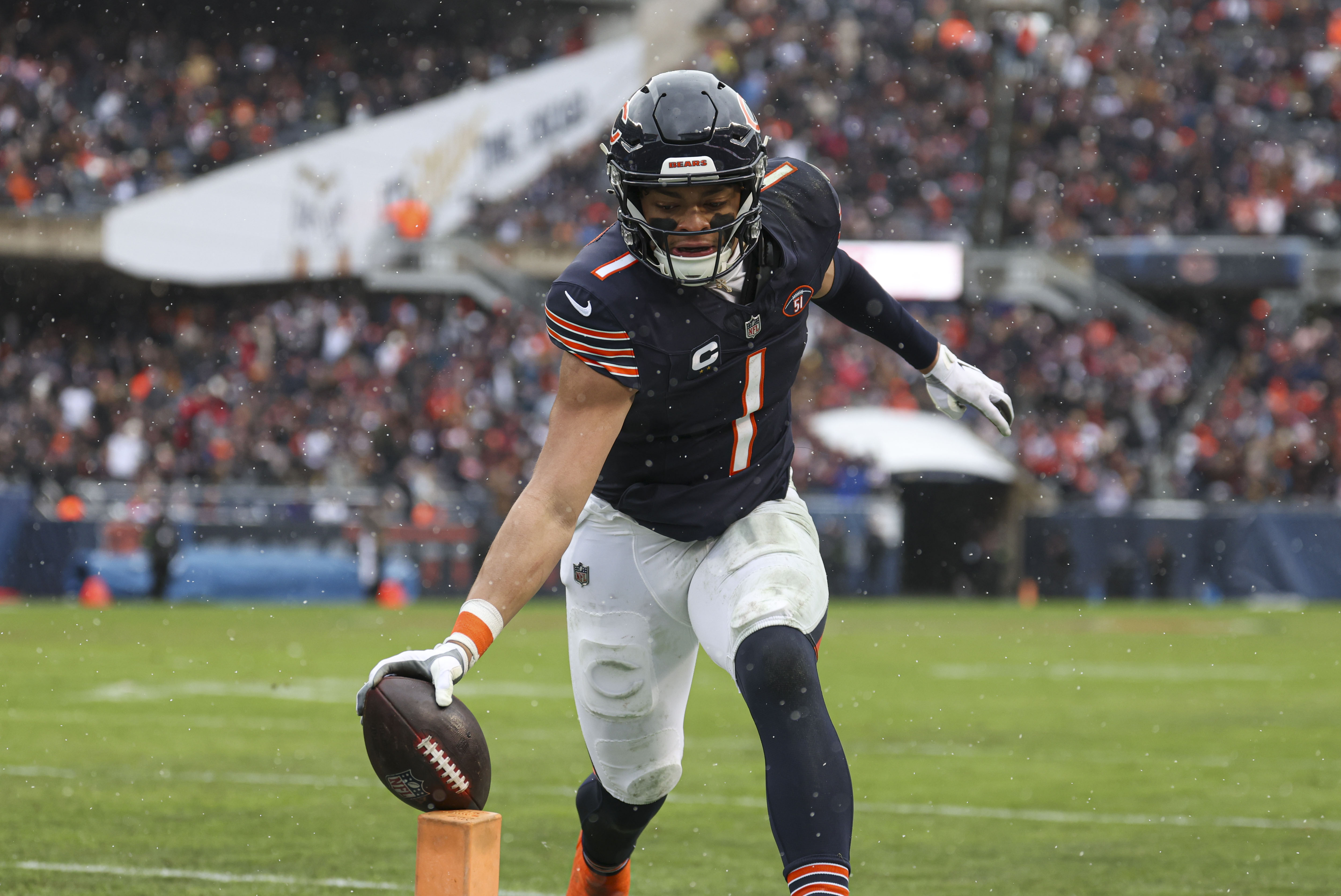 Bears quarterback Justin Fields stretches the ball to the pylon for a touchdown against the Falcons in the second quarter Dec. 31, 2023, at Soldier Field. (Brian Cassella/Chicago Tribune)