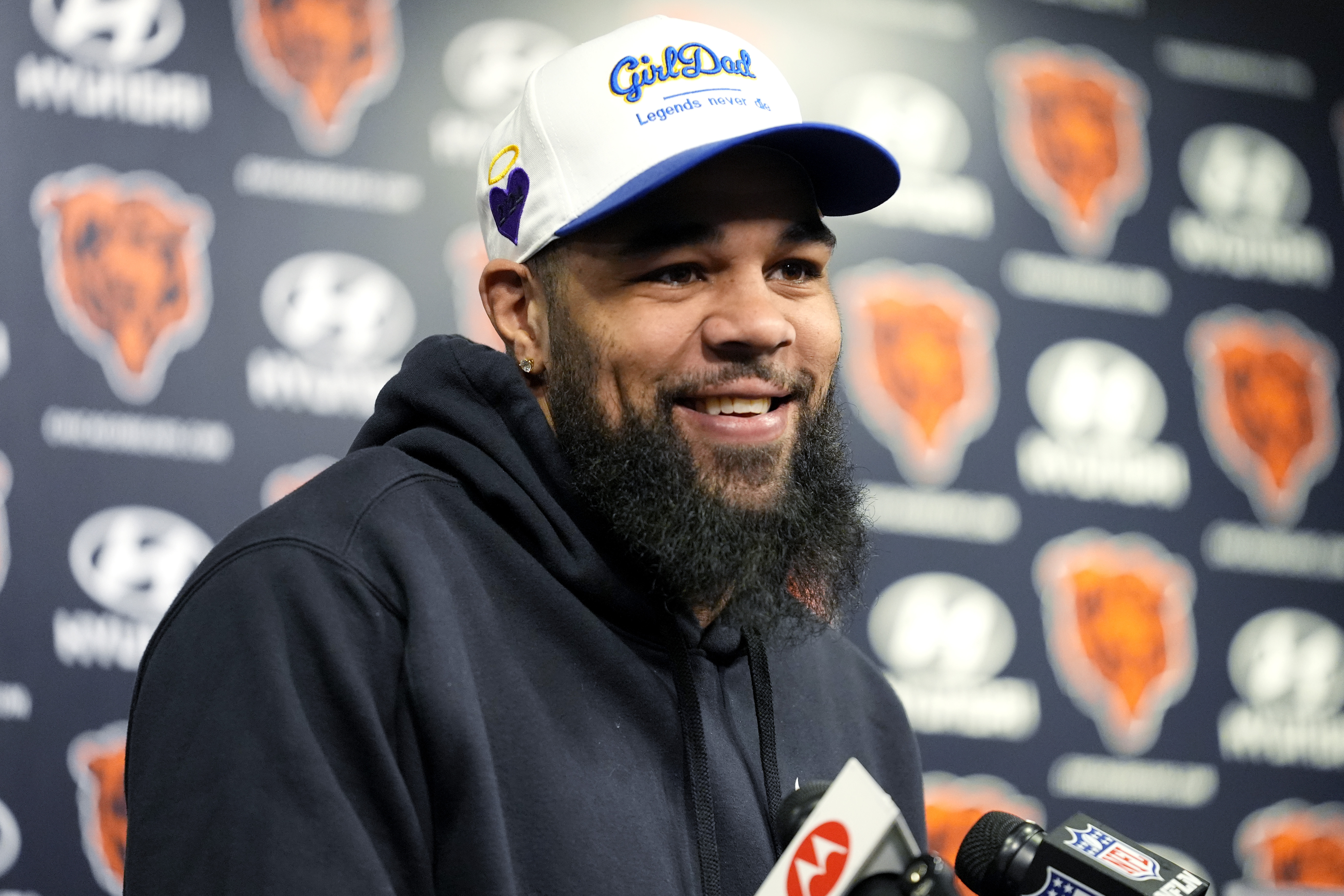 Chicago Bears wide receiver Keenan Allen smiles as he listens to reporters at a news conference at Halas Hall in Lake Forest, Ill., Saturday, March 16, 2024. A day after the Chargers released wide receiver Mike Williams, the team decided to ship star wideout Keenan Allen to the Chicago Bears in exchange for a fourth-round pick. (AP Photo/Nam Y. Huh)