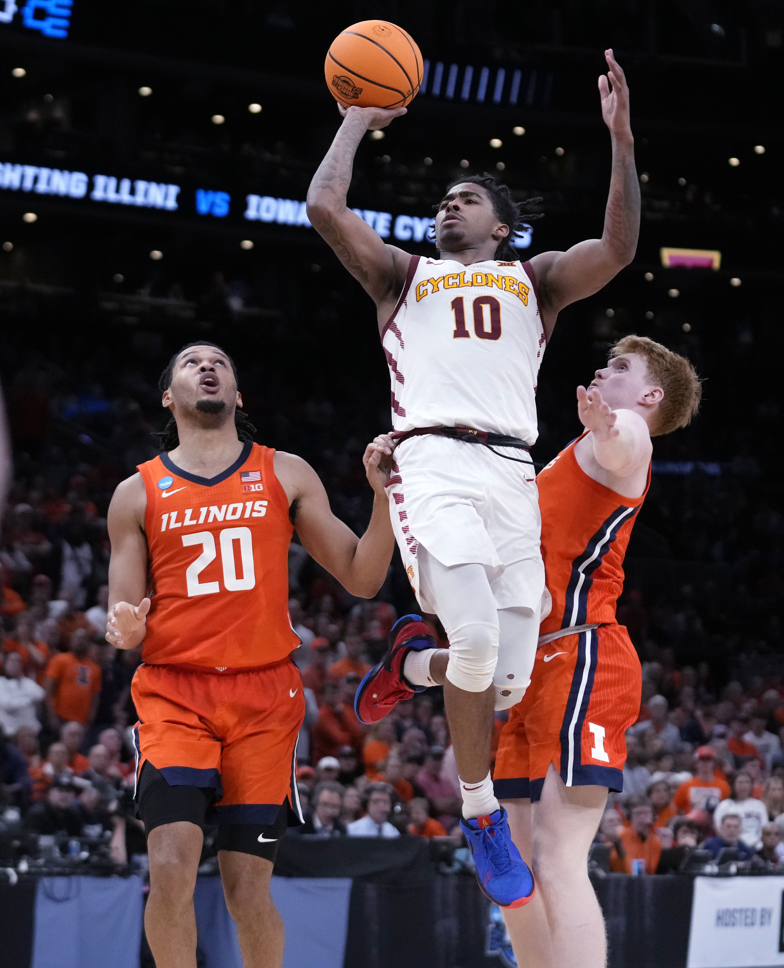 Iowa State guard Keshon Gilbert (10) drives to the basket past Illinois forward Ty Rodgers (20) during the second half of the Sweet 16 college basketball game in the men's NCAA Tournament, Thursday, March 28, 2024, in Boston. (AP Photo/Steven Senne)