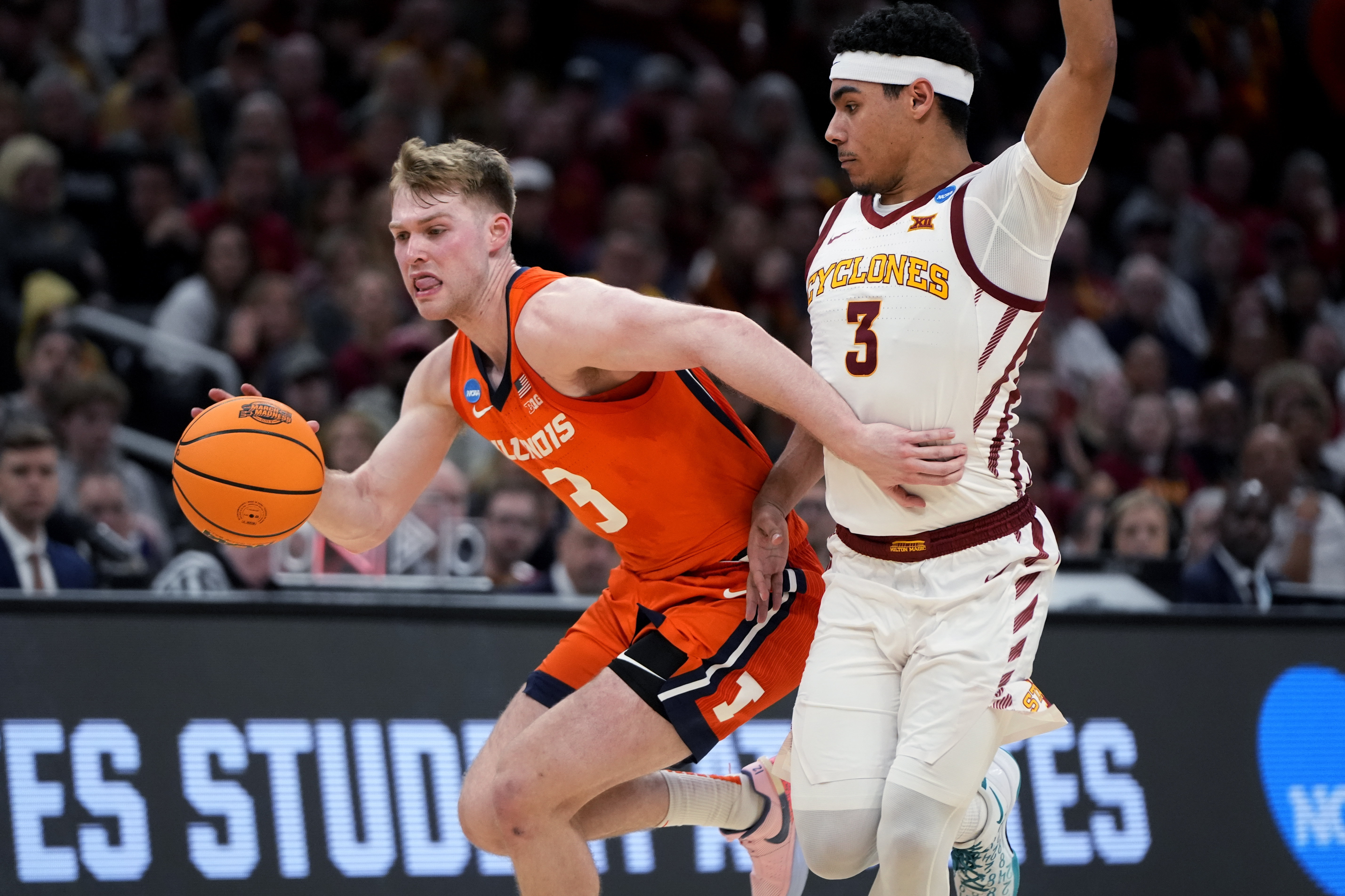 Illinois forward Marcus Domask, left, drives past Iowa State guard Tamin Lipsey, right, during the second half of the Sweet 16 college basketball game in the men's NCAA Tournament, Thursday, March 28, 2024, in Boston. (AP Photo/Michael Dwyer)