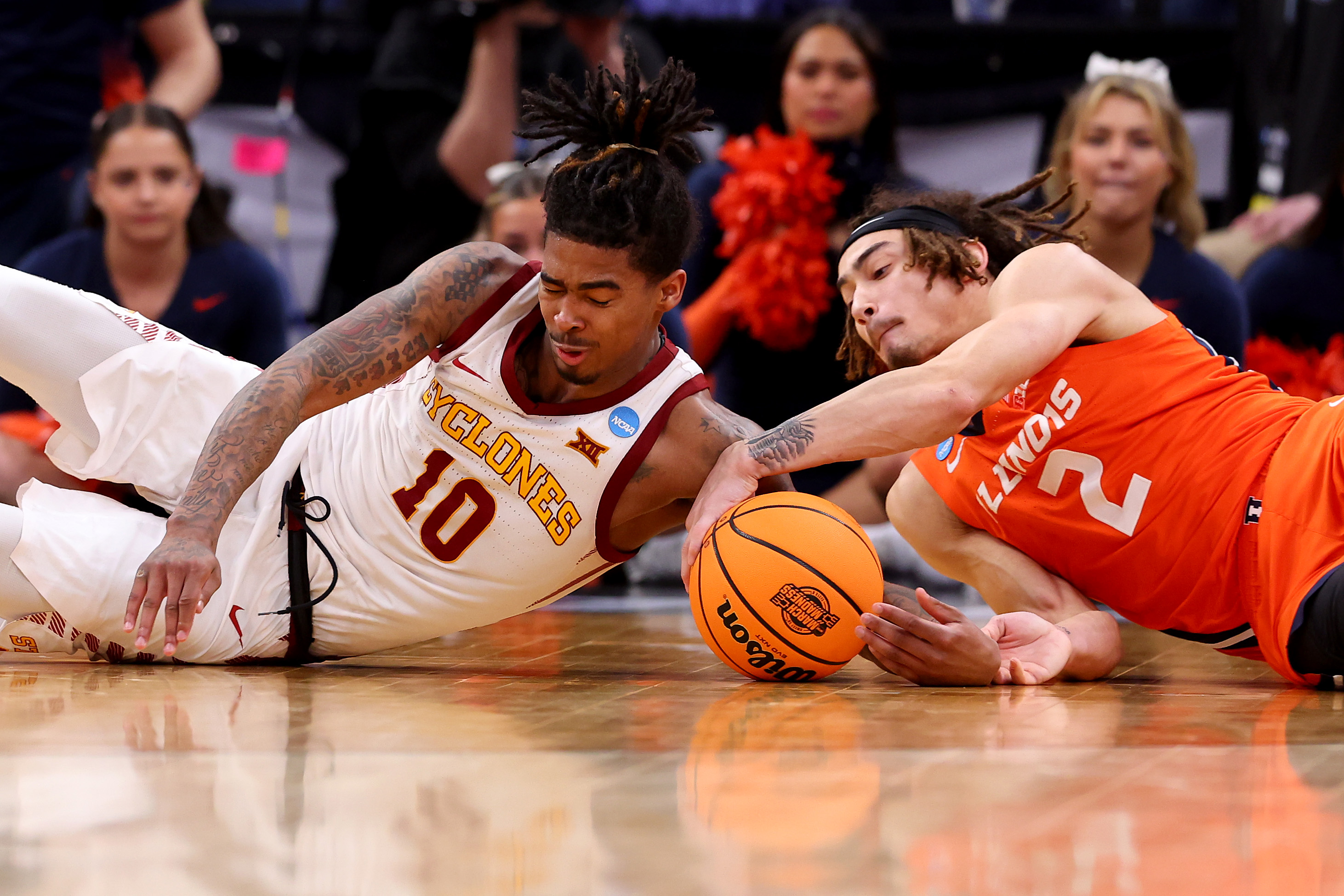 Iowa State's Keshon Gilbert, left, battles Illinois' Dra Gibbs-Lawhorn during a Sweet 16 game in the NCAA Tournament on March 28, 2024, in Boston. (Michael Reaves/Getty)