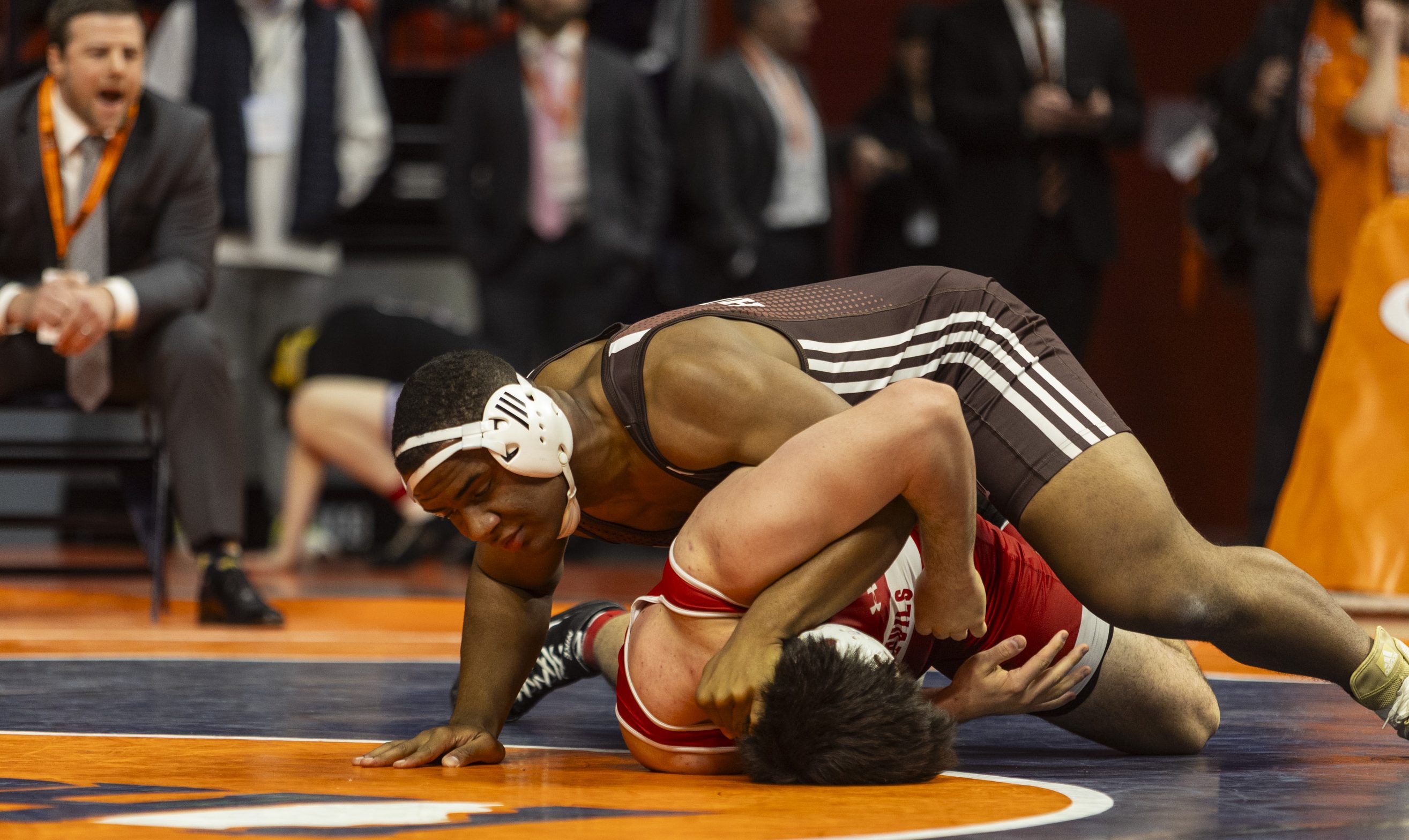 Joliet Catholic's Dillan Johnson worksover Hinsdale Central's Marko Ivanisevic during the 285 pound bout in the class 3A state wrestling championship at the State Farm Center at University of Illinois in Champaign on Saturday, Feb. 17, 2024. (Vincent D. Johnson / Daily Southtown).