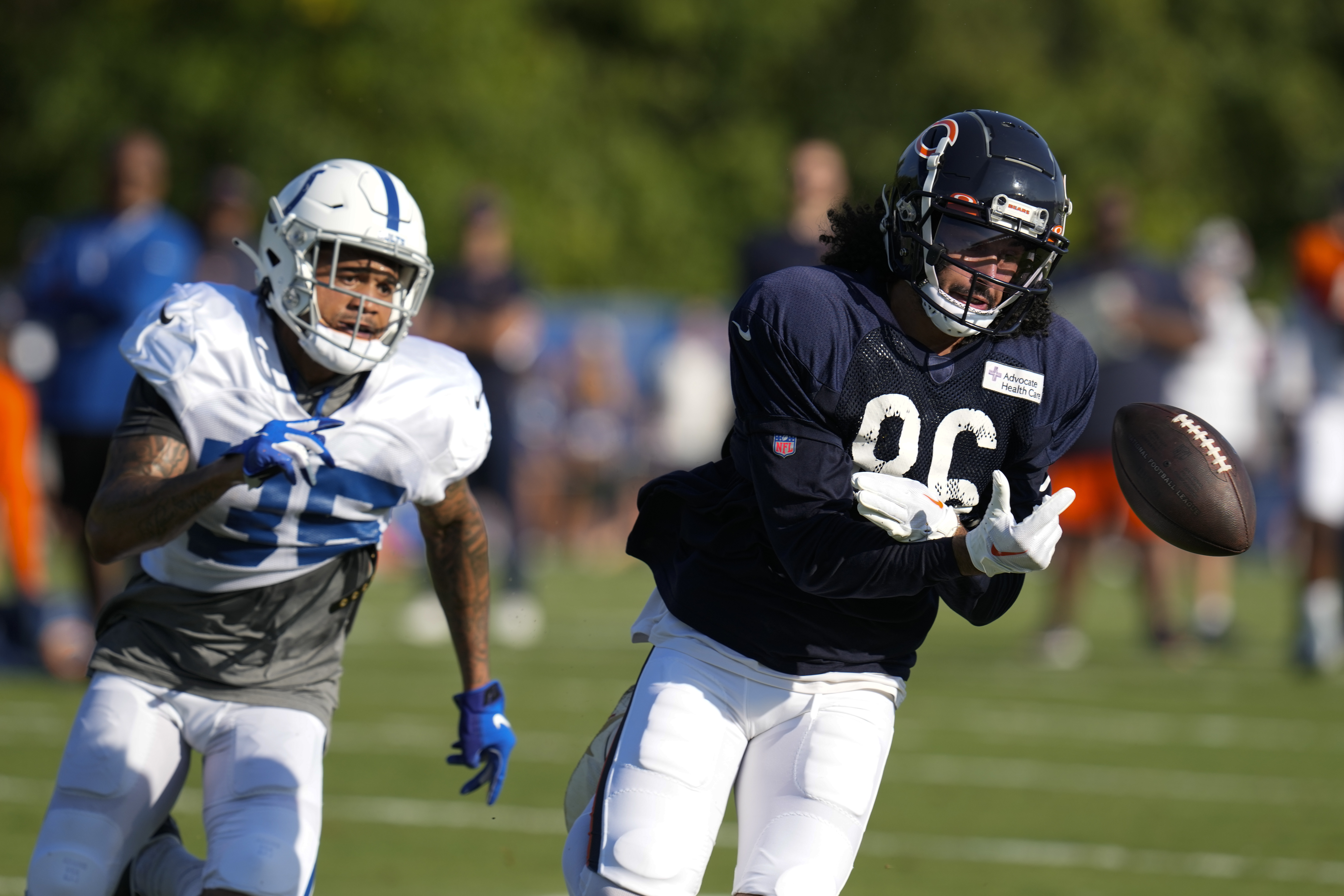 Bears wide receiver Dante Pettis drops a pass in front of Colts safety Michael Tutsie during a joint practice in Westfield, Ind., on Aug. 16, 2023.