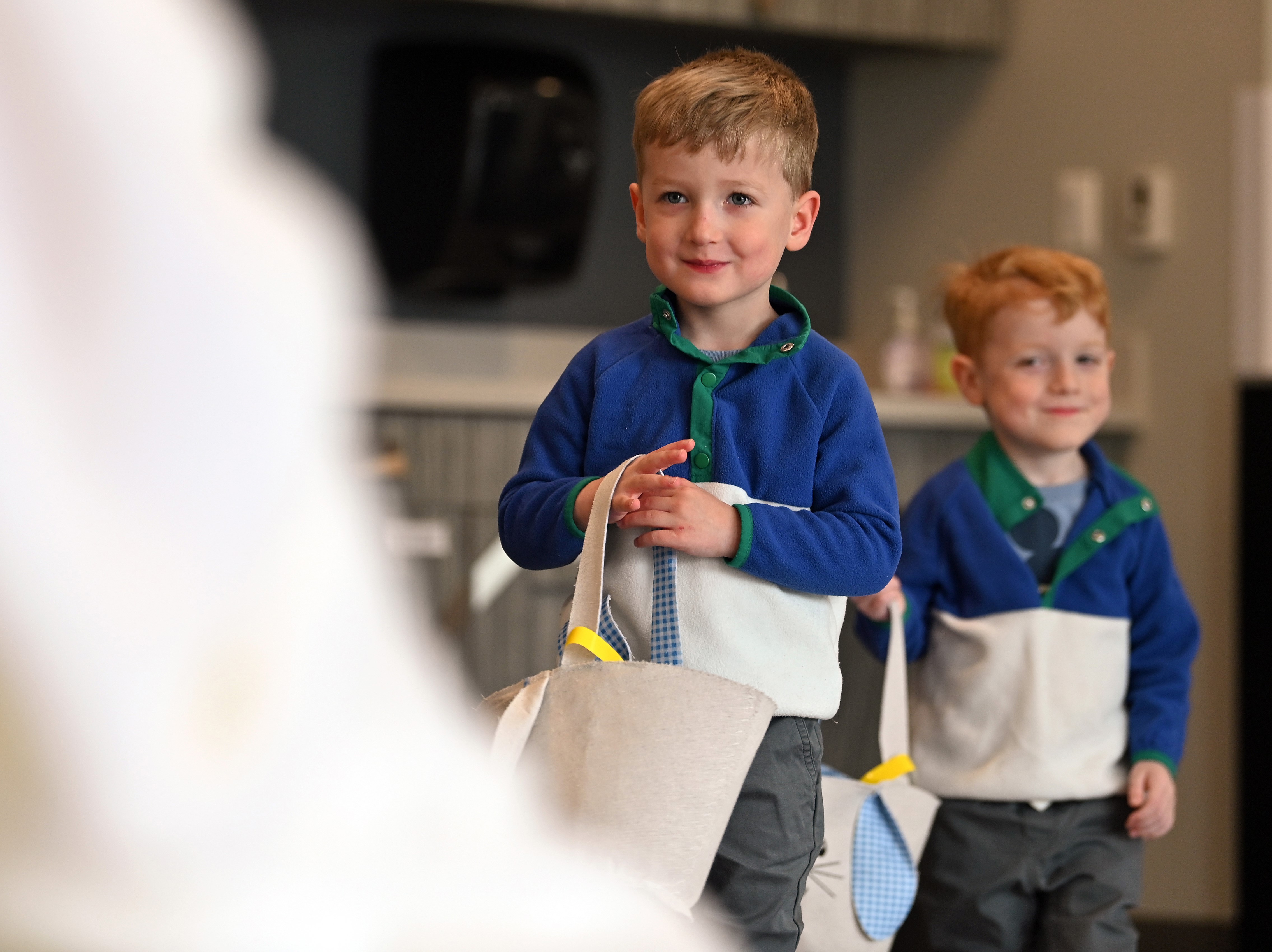 Approaching the spring plush bunny with excitement are, from left, twins Mason and Peyton Kniskern, 3, from Mundelein at the Cottontail Trail event on March 16, 2024 at the Dunbar Recreation Center at Community Park in Mundelein. (Karie Angell Luc/Lake County News-Sun)