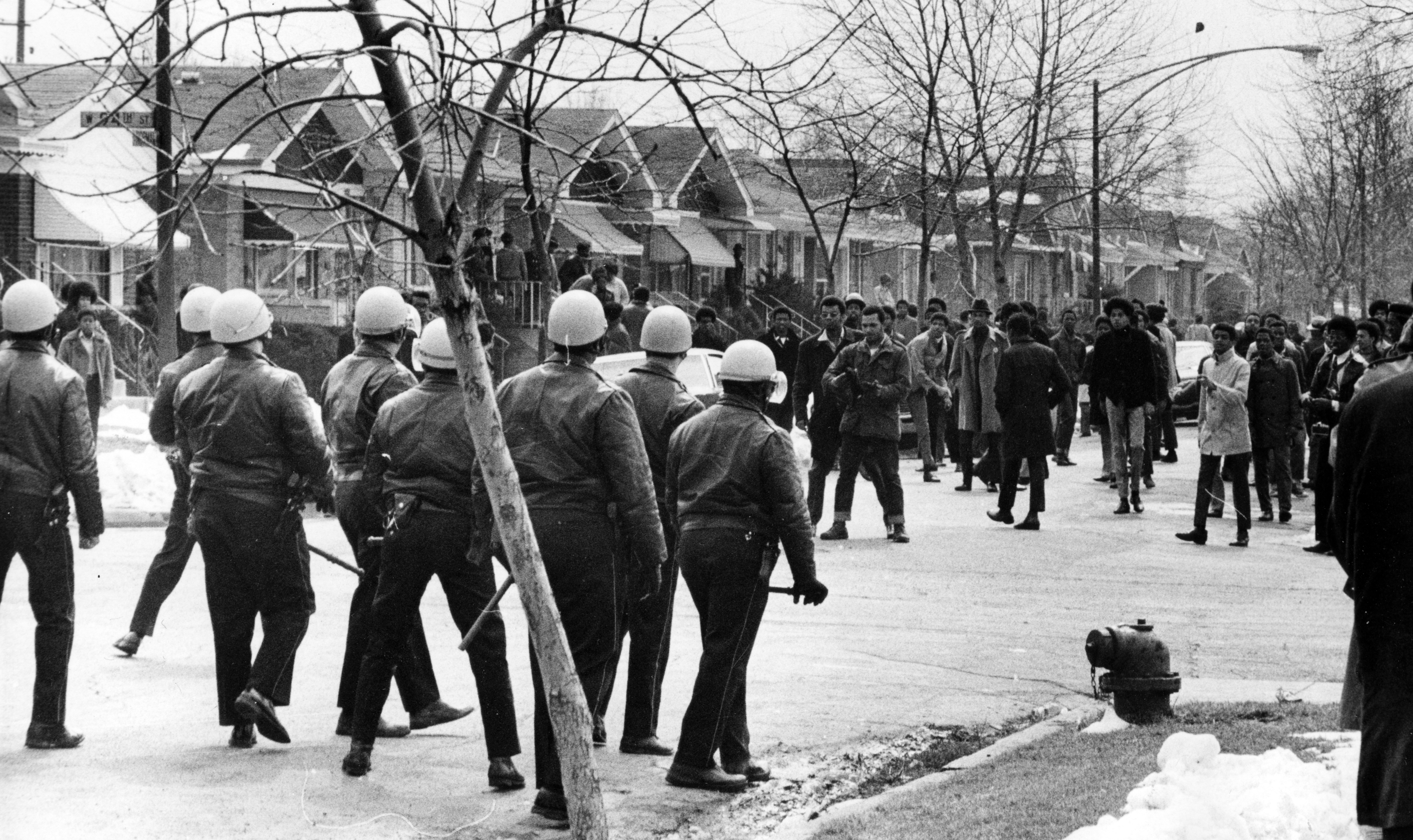 Angry members of the Contract Buyers League confront Chicago police after sheriff's police and movers evicted 12 families from their homes on Eggleston Avenue on March 31, 1970. Rocks were thrown at police. (Arthur Walker/Chicago Tribune)