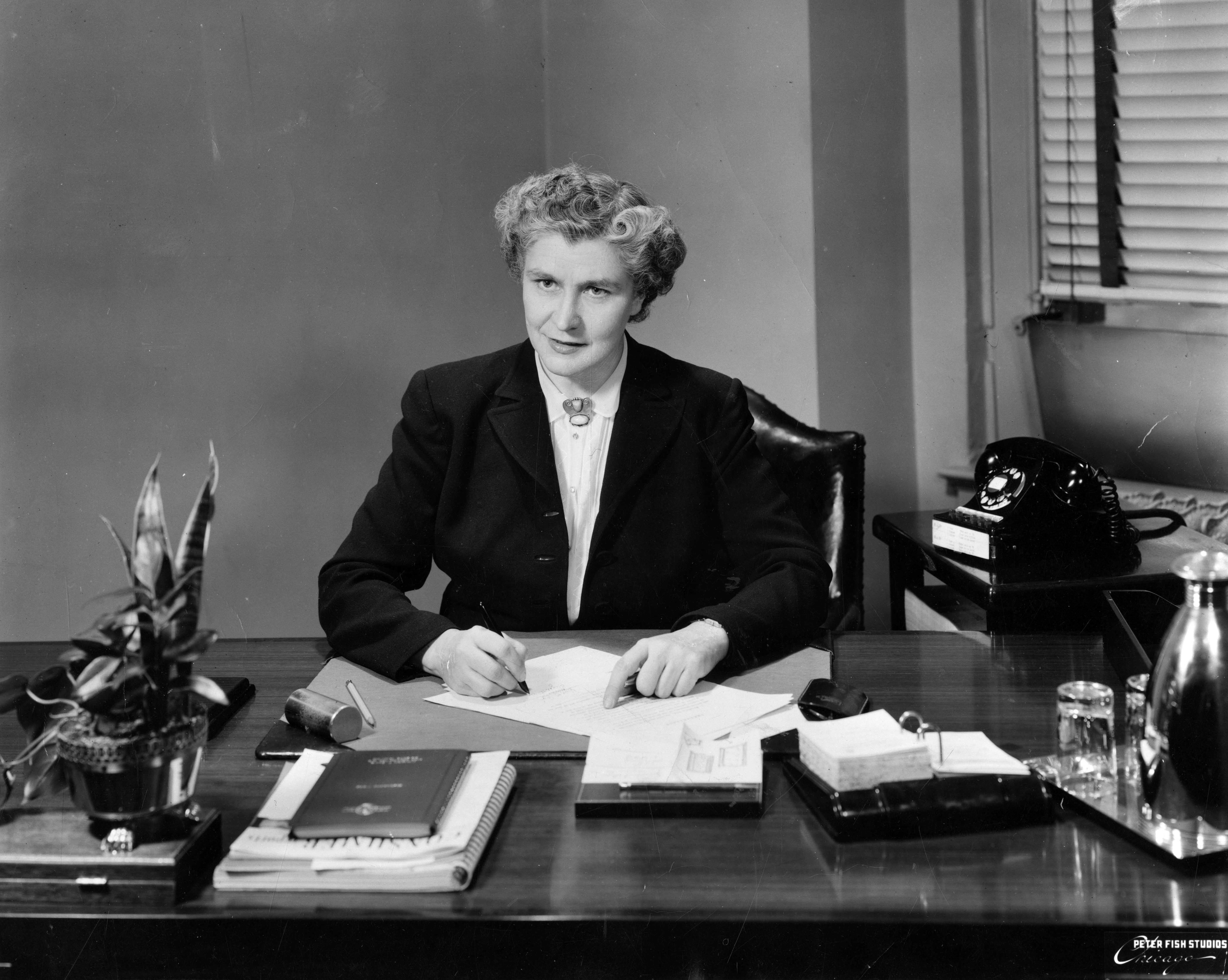 Chicago Housing Authority executive secretary Elizabeth Wood at her desk, circa 1953. (Peter Fish Studios)