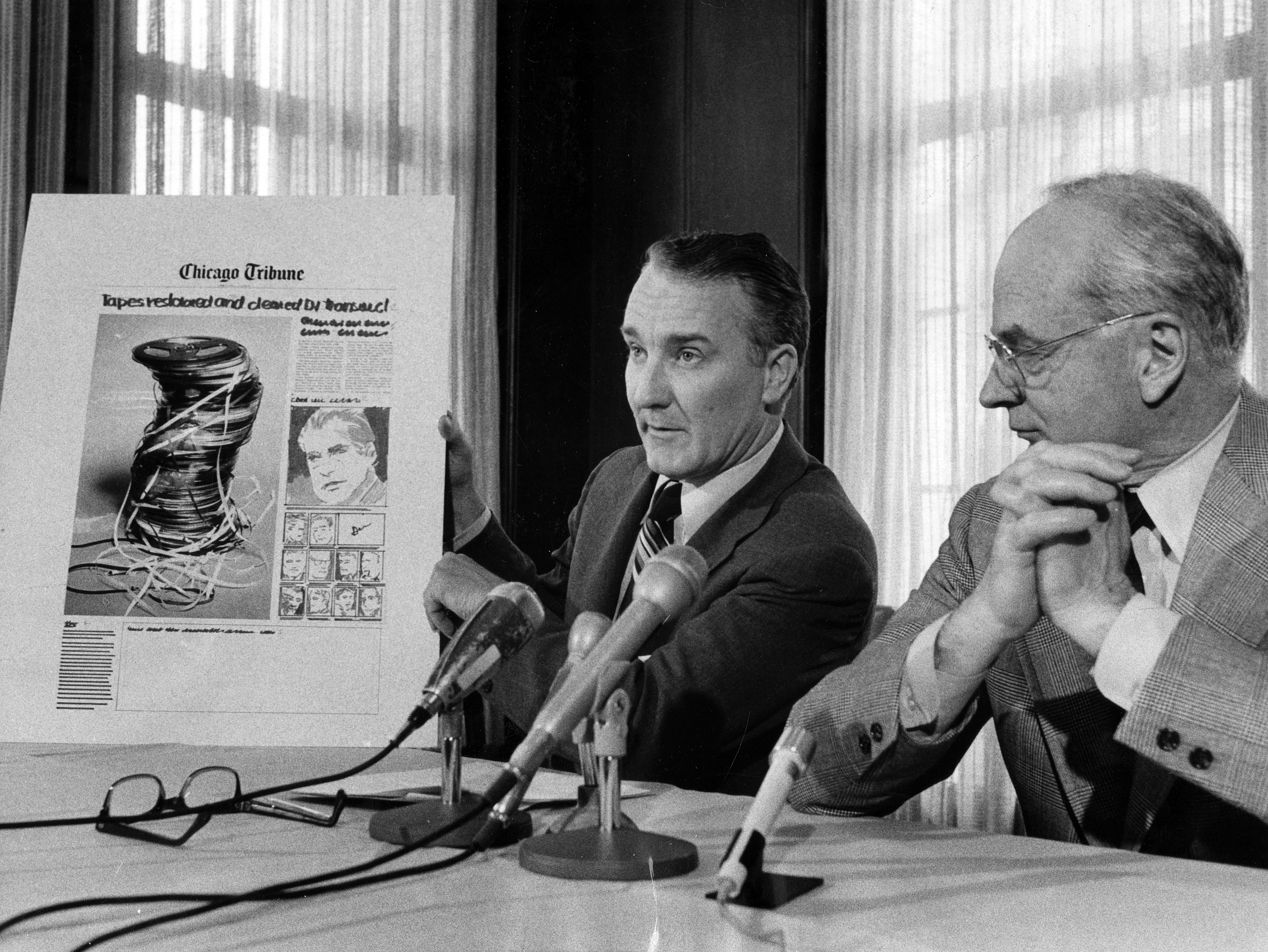 Chicago Tribune publisher Stanton Cook, center, and editor Clayton Kirkpatrick speak at a press conference on April 30, 1974, regarding the Tribune's publication of the Nixon tapes. (Chicago Tribune historical photo)