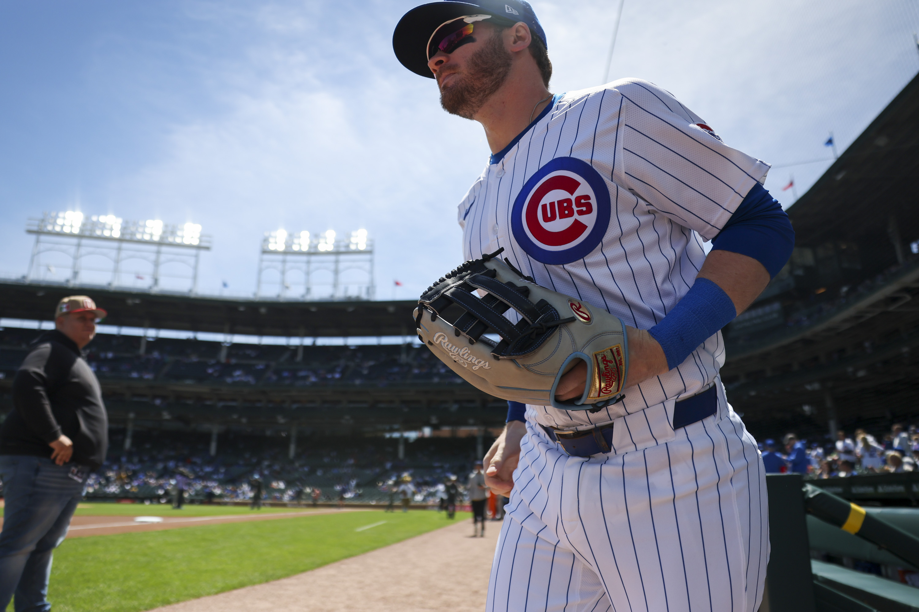 Chicago Cubs outfielder Ian Happ (8) runs onto the field before the game against the Milwaukee Brewers at Wrigley Field on May 5, 2024. (Eileen T. Meslar/Chicago Tribune)
