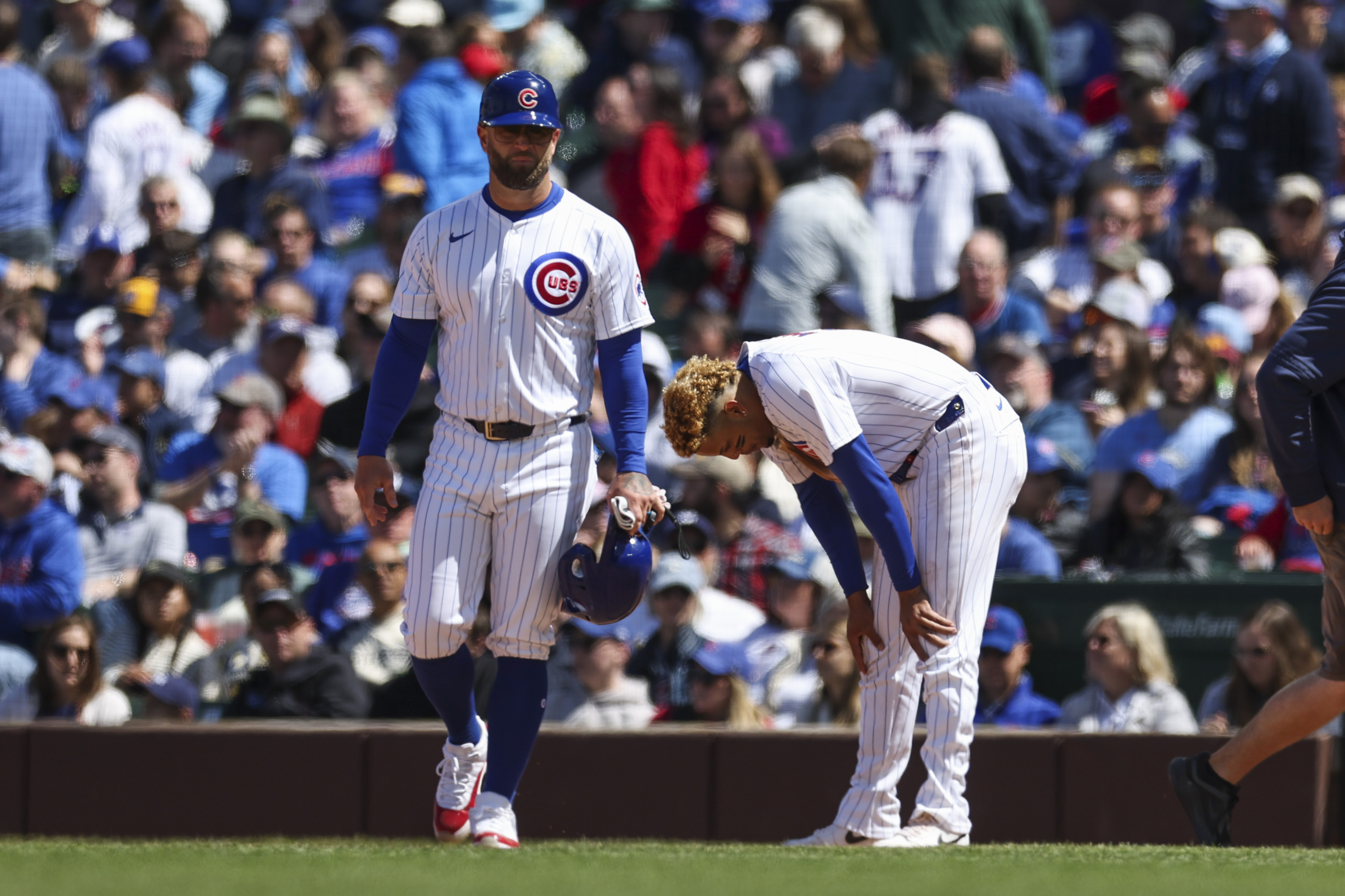 Chicago Cubs third base Christopher Morel (5) takes a moment after getting doubled up on a line drive from Chicago Cubs shortstop Dansby Swanson (7) during the fourth inning against the Milwaukee Brewers at Wrigley Field on May 5, 2024. (Eileen T. Meslar/Chicago Tribune)