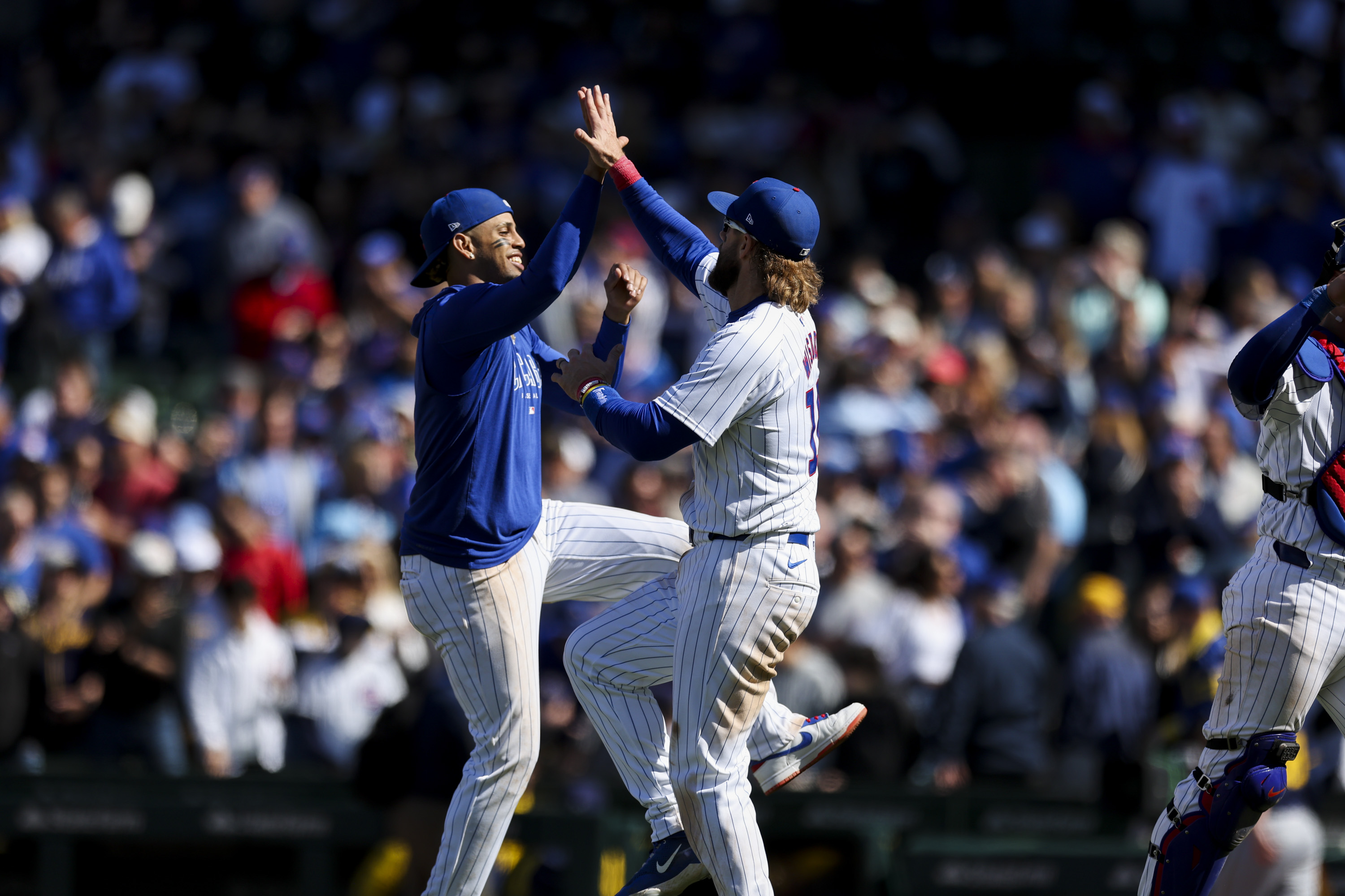 Chicago Cubs third base Christopher Morel (5) and Chicago Cubs outfielder Patrick Wisdom (16) celebrate after winning the game against the Milwaukee Brewers at Wrigley Field on May 5, 2024. (Eileen T. Meslar/Chicago Tribune)