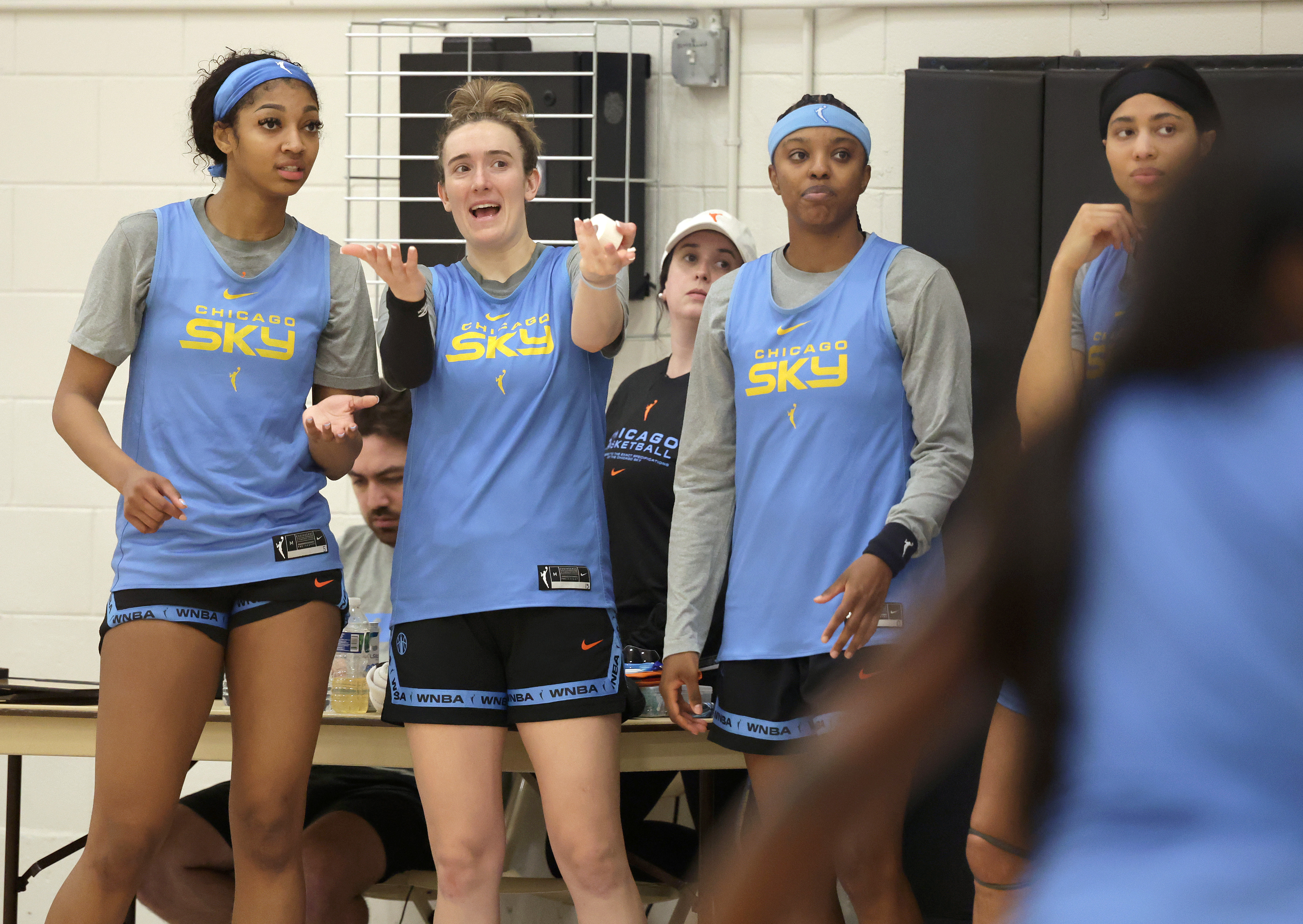 Chicago Sky players left to right: Angel Reese, Marina Mabrey, Diamond DeShields, and Isabelle Harrison watch from the sidelines during Chicago Sky training camp at the Sachs Recreation Center on May 1, 2024, in Deerfield. (Stacey Wescott/Chicago Tribune)