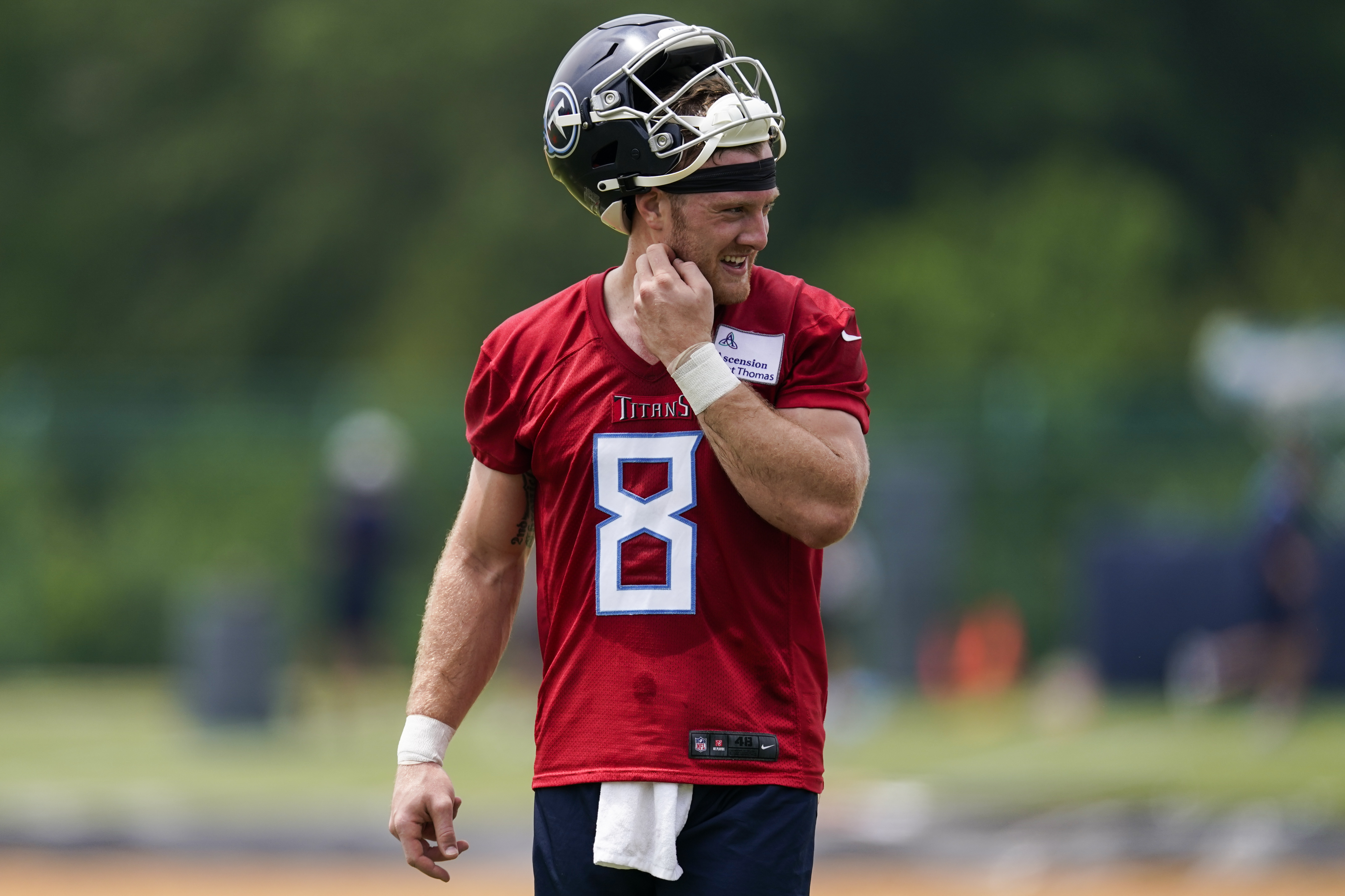 Titans quarterback Will Levis walks across the field during OTAs on May 23, 2023, in Nashville, Tenn. (AP Photo/George Walker IV)