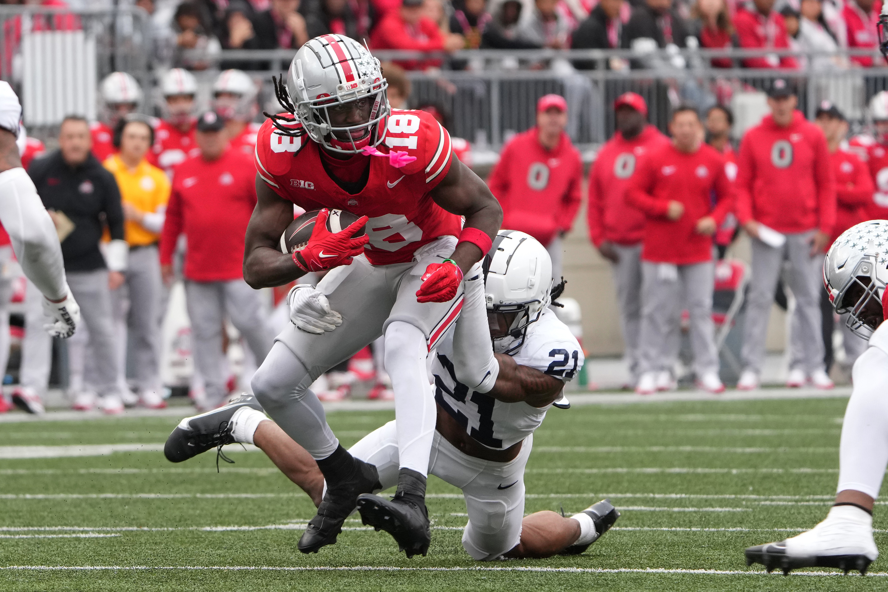 Ohio State wide receiver Marvin Harrison Jr. is tackled by Penn State safety Kevin Winston Jr. on Oct. 21, 2023, in Columbus, Ohio. (Jason Mowry/Getty)