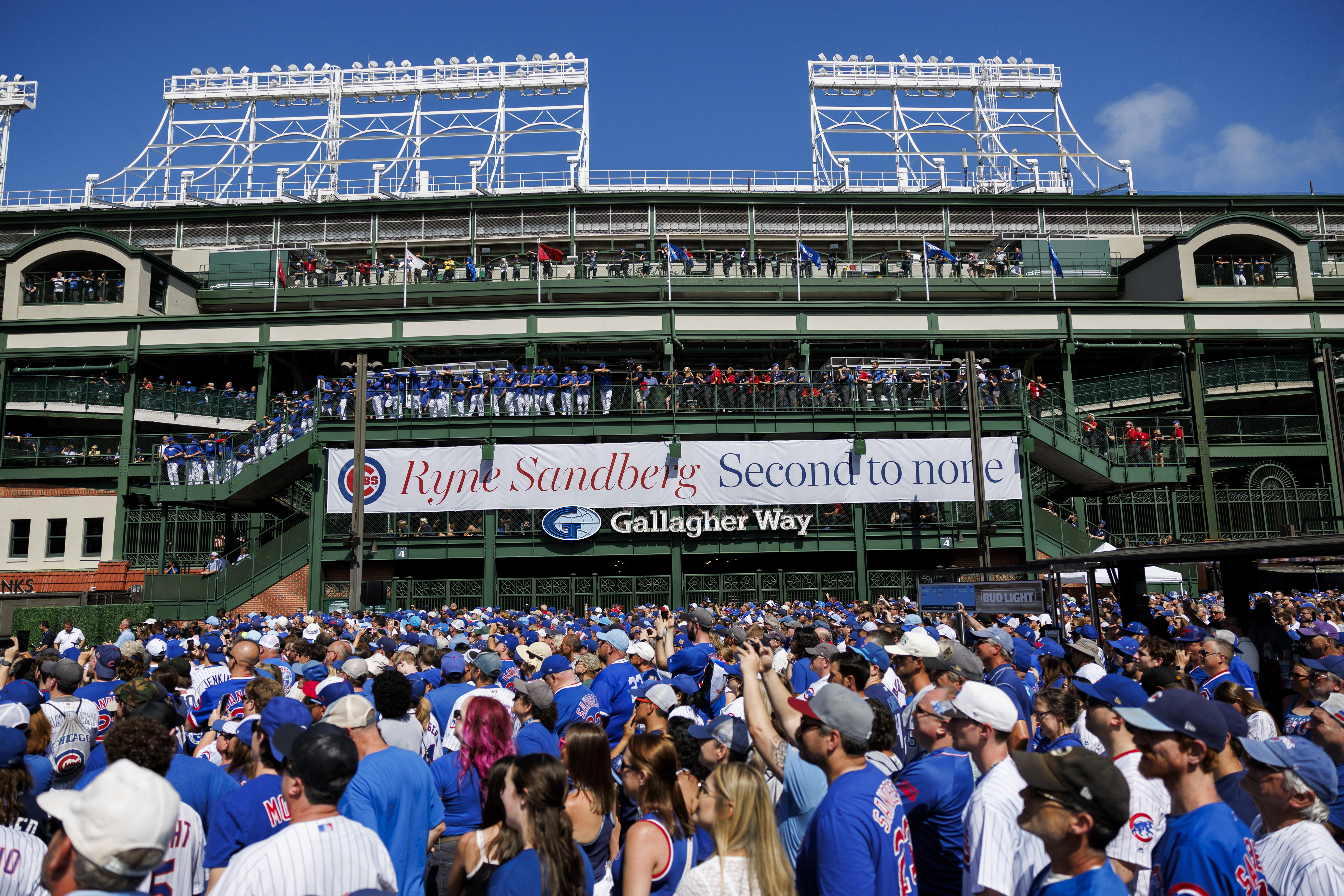 Fans and Cubs players attend a statue dedication ceremony for former Cubs player Ryne Sandberg outside Wrigley Field Sunday June 23, 2024 in Chicago. (Armando L. Sanchez/Chicago Tribune)