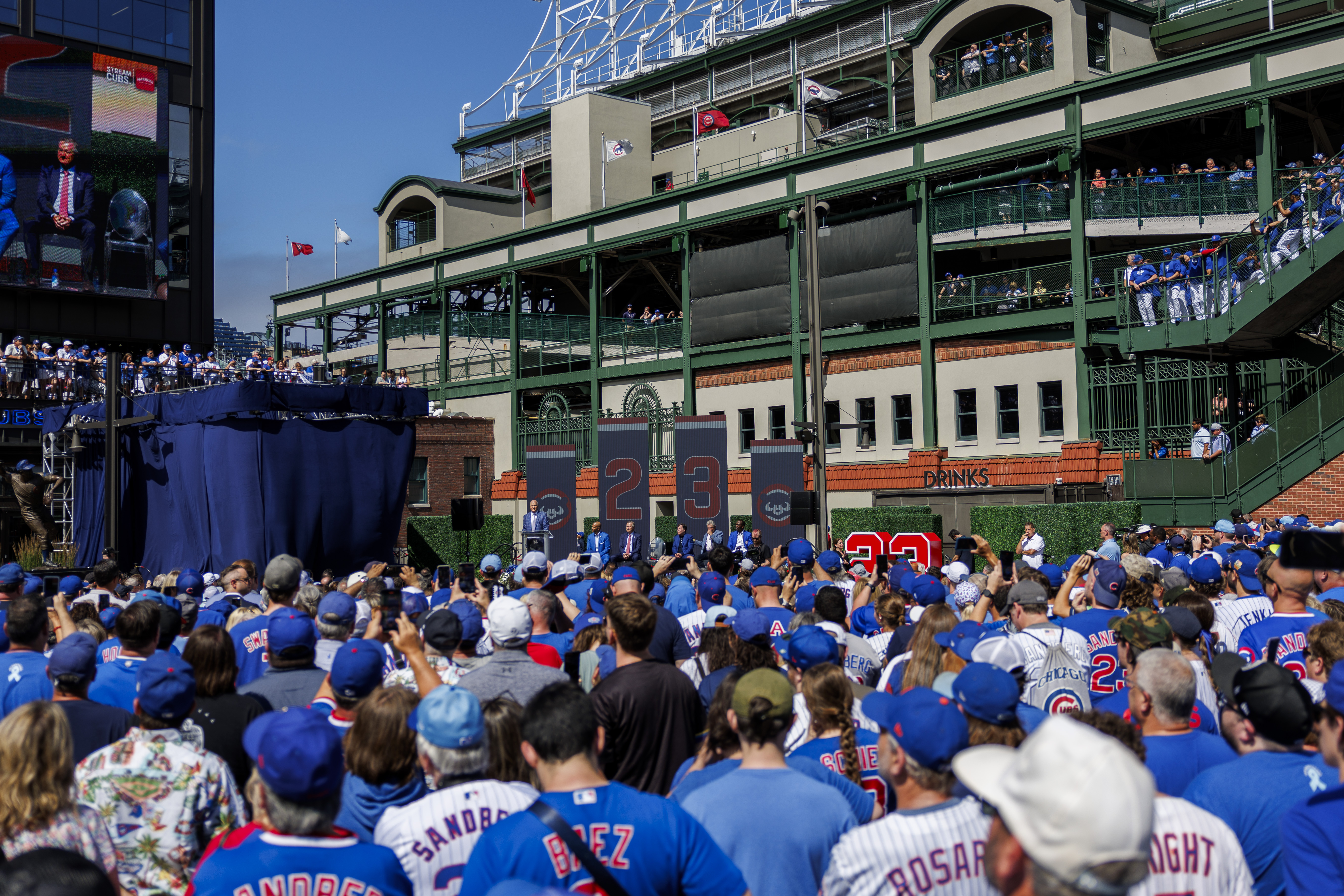 Fans and Cubs players attend a statue dedication ceremony for former Cubs player Ryne Sandberg outside Wrigley Field Sunday June 23, 2024 in Chicago. (Armando L. Sanchez/Chicago Tribune)