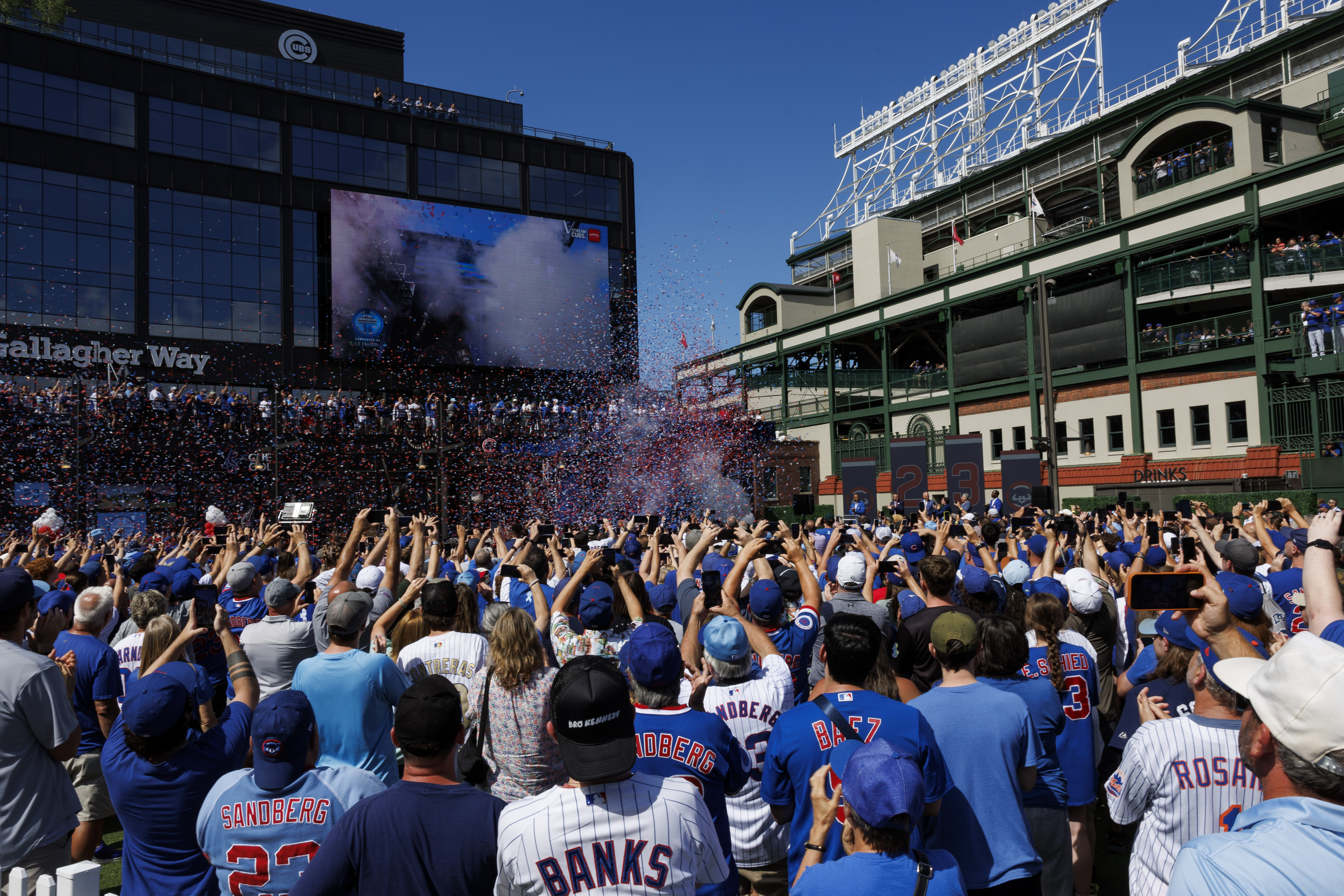 Fans and Cubs players attend a statue dedication ceremony for former Cubs player Ryne Sandberg outside Wrigley Field Sunday June 23, 2024 in Chicago. (Armando L. Sanchez/Chicago Tribune)