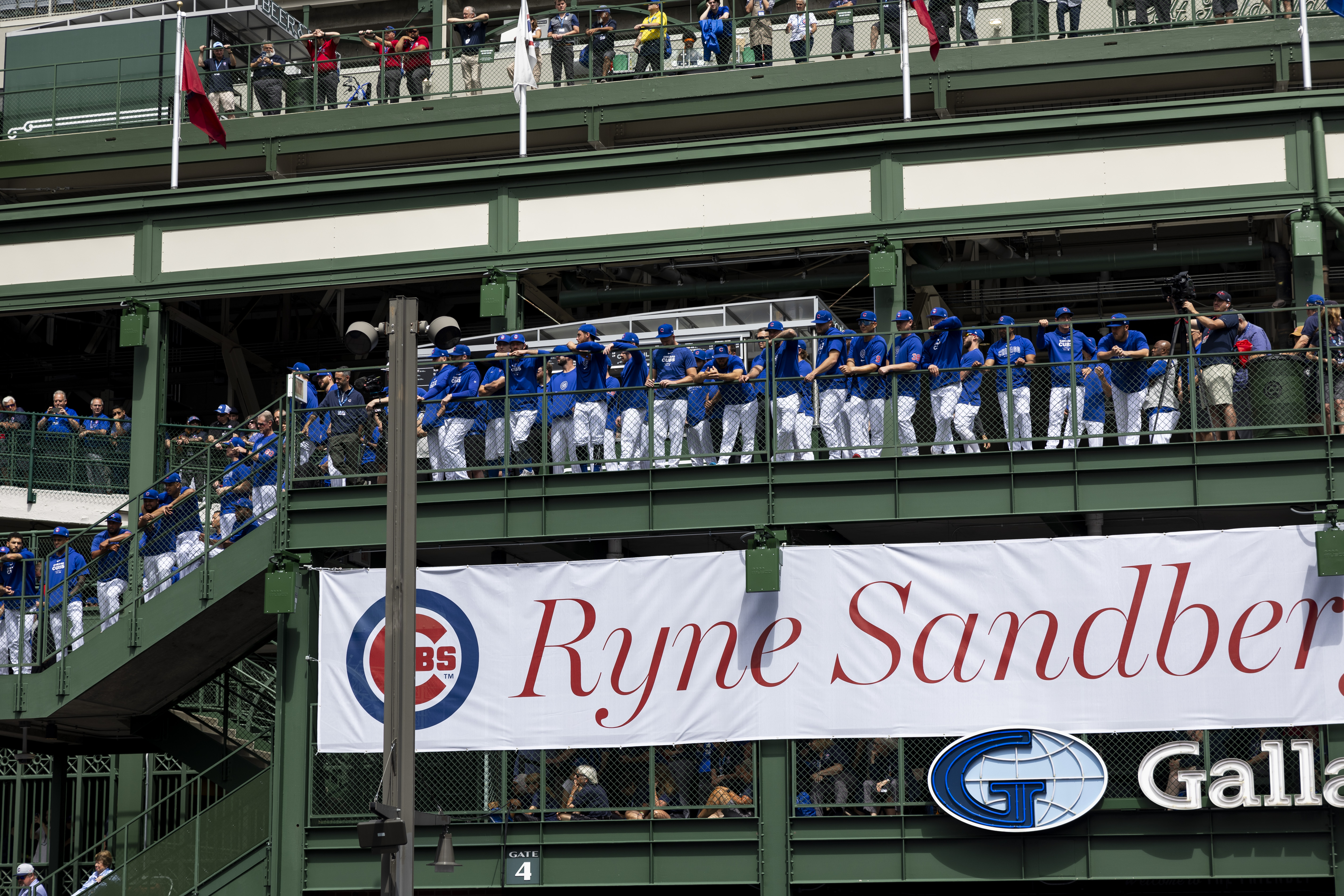 Cubs players attend a statue dedication ceremony for former Cubs player Ryne Sandberg outside Wrigley Field Sunday June 23, 2024 in Chicago. (Armando L. Sanchez/Chicago Tribune)