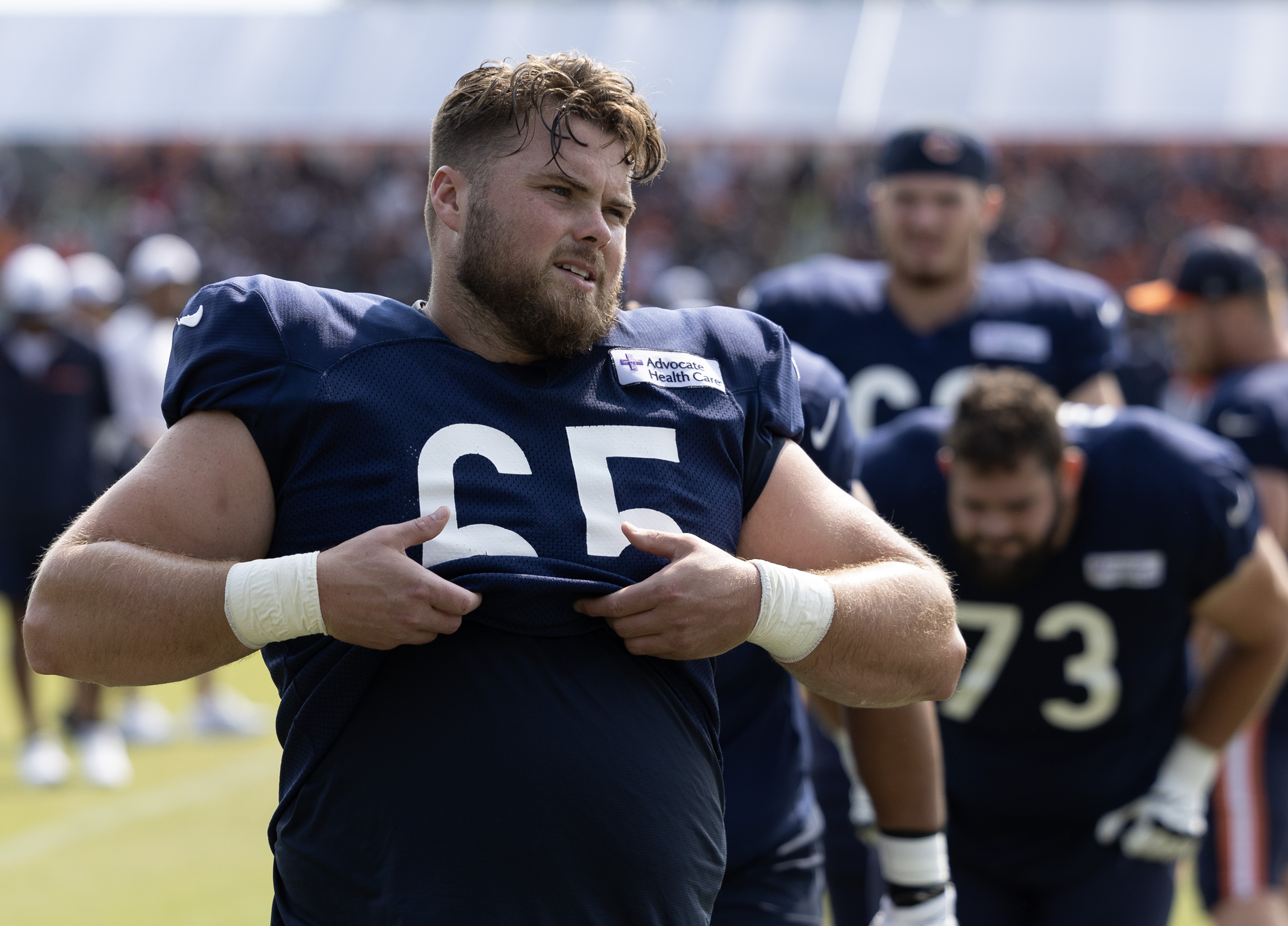 Bears center Coleman Shelton airs out his jersey during a full-pads practice at training camp on July 26, 2024, in Lake Forest. (Stacey Wescott/Chicago Tribune)