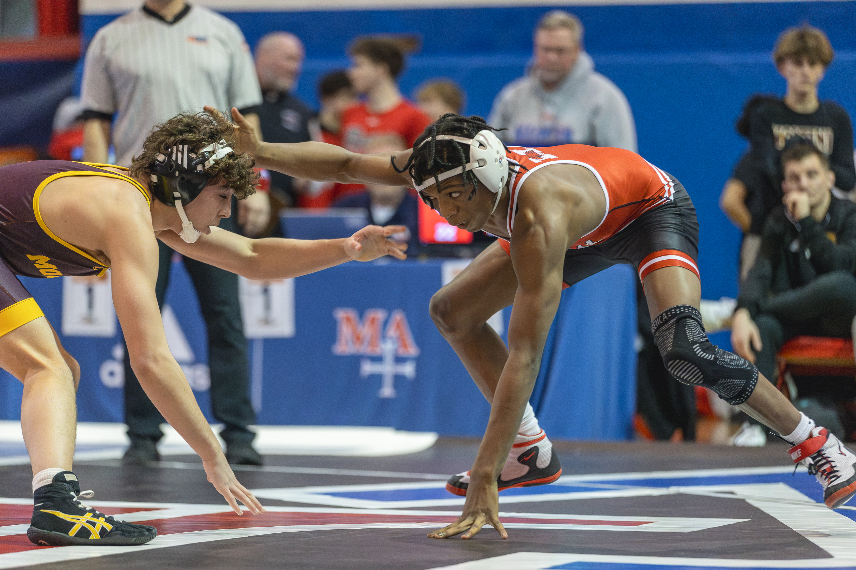 Marist's Te'Jon Beals wrestles against Montini's Mikey Malizzio during a 132 pound match in the Class 3A Marmion Dual Team sectional l in Aurora on Thursday, Feb. 4, 2026. (Troy Stolt for the Beacon News)